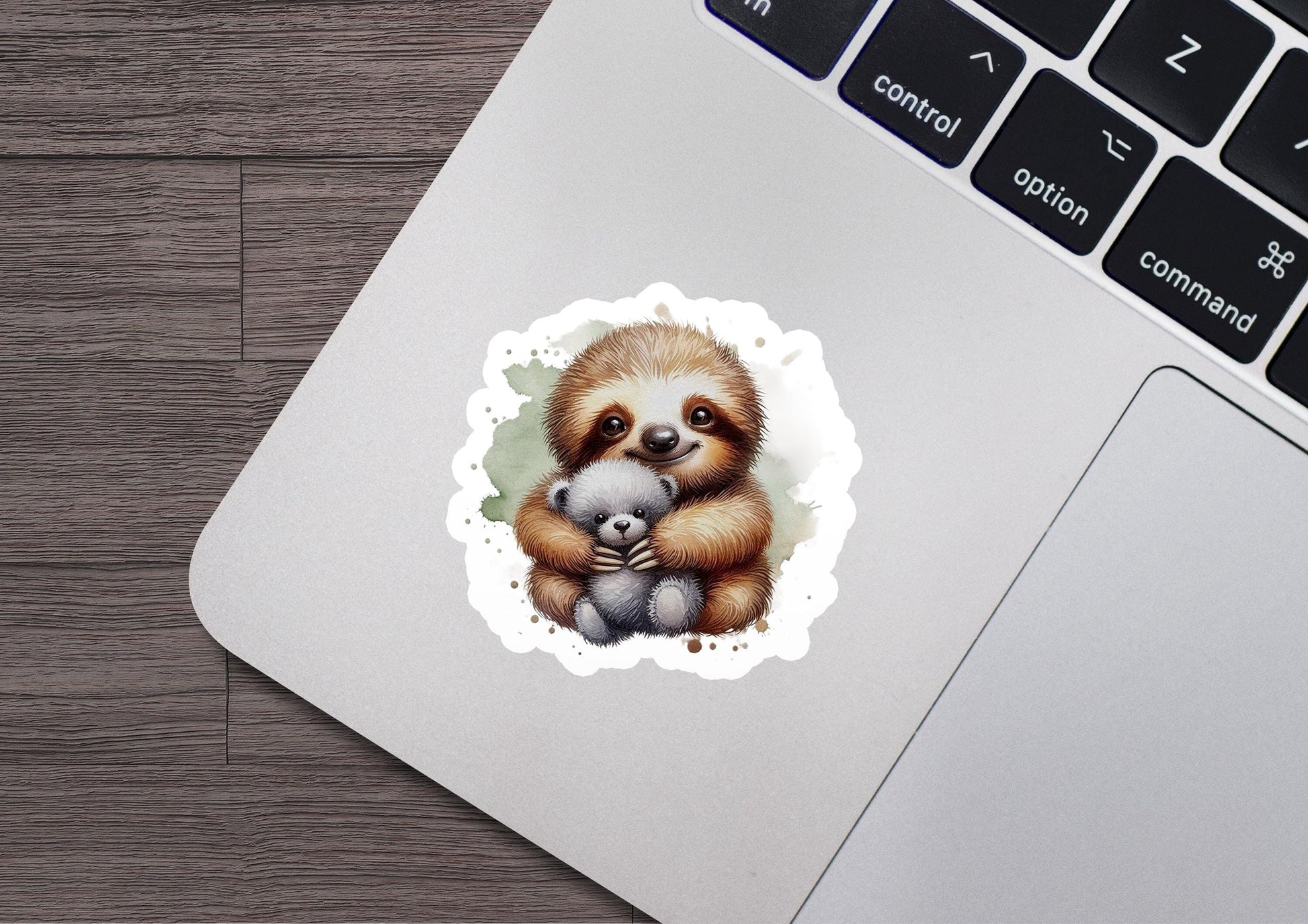 a sticker of a baby sloth holding a stuffed animal