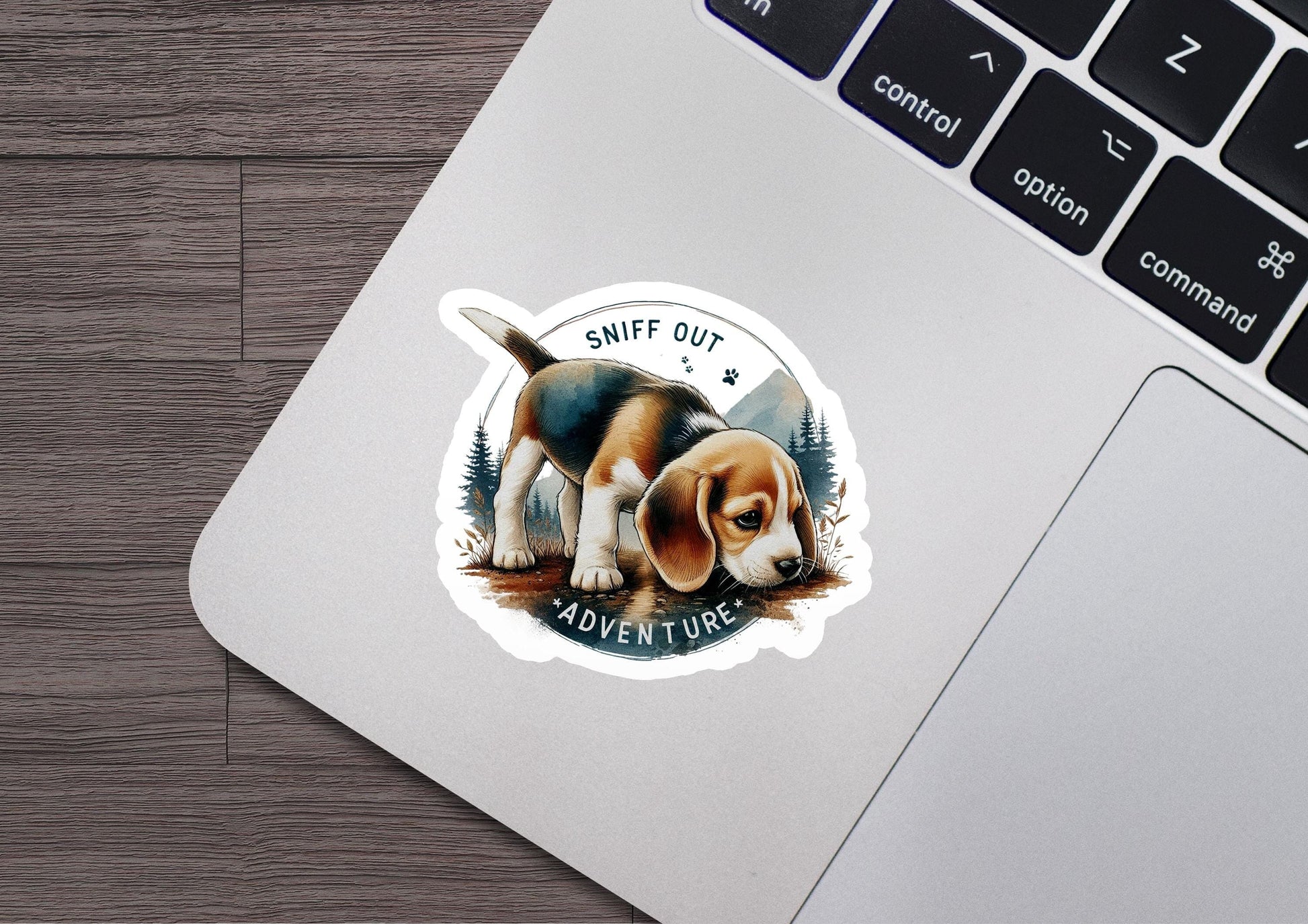 a sticker of a dog sitting on top of a laptop