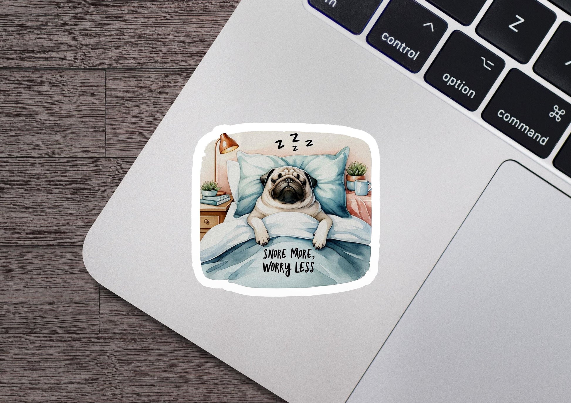 a sticker of a pug dog sleeping on a bed