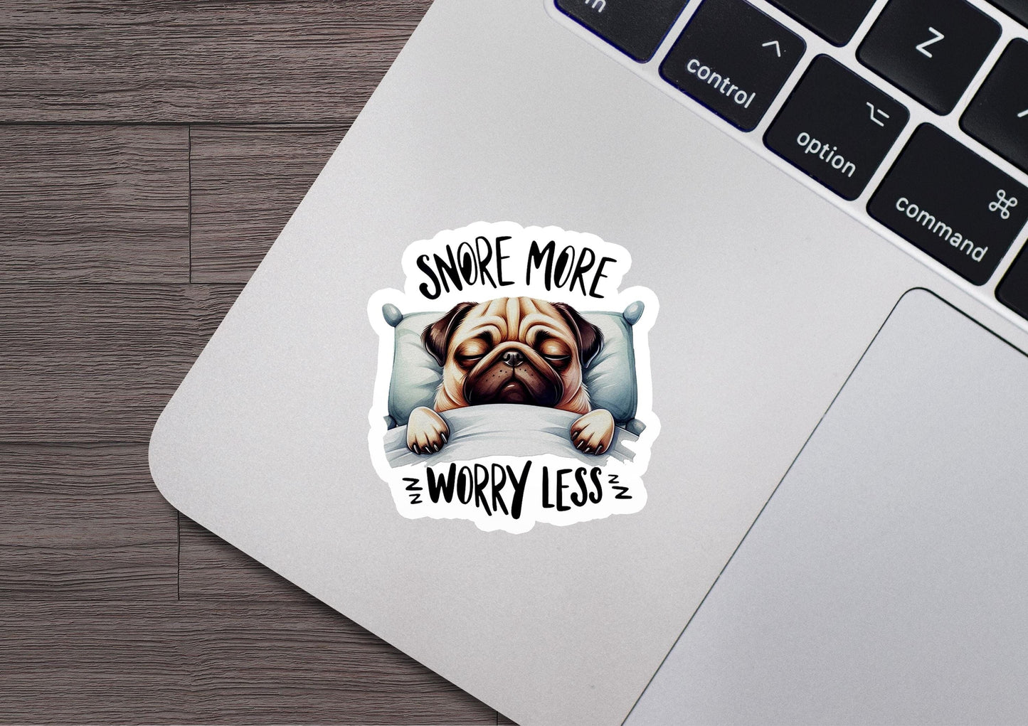 a sticker of a pug dog sleeping on a pillow