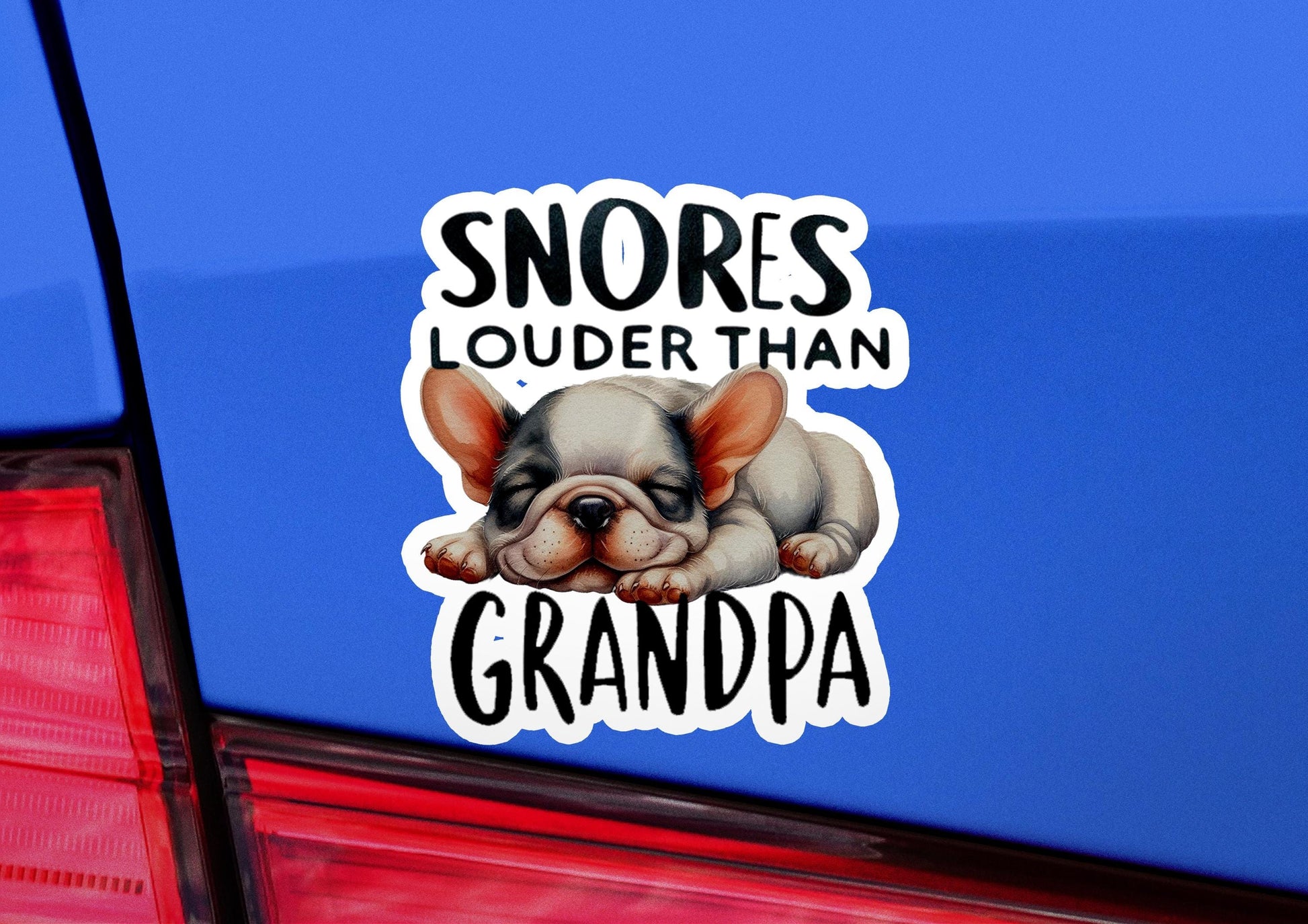 a sticker of a dog sleeping on the back of a car