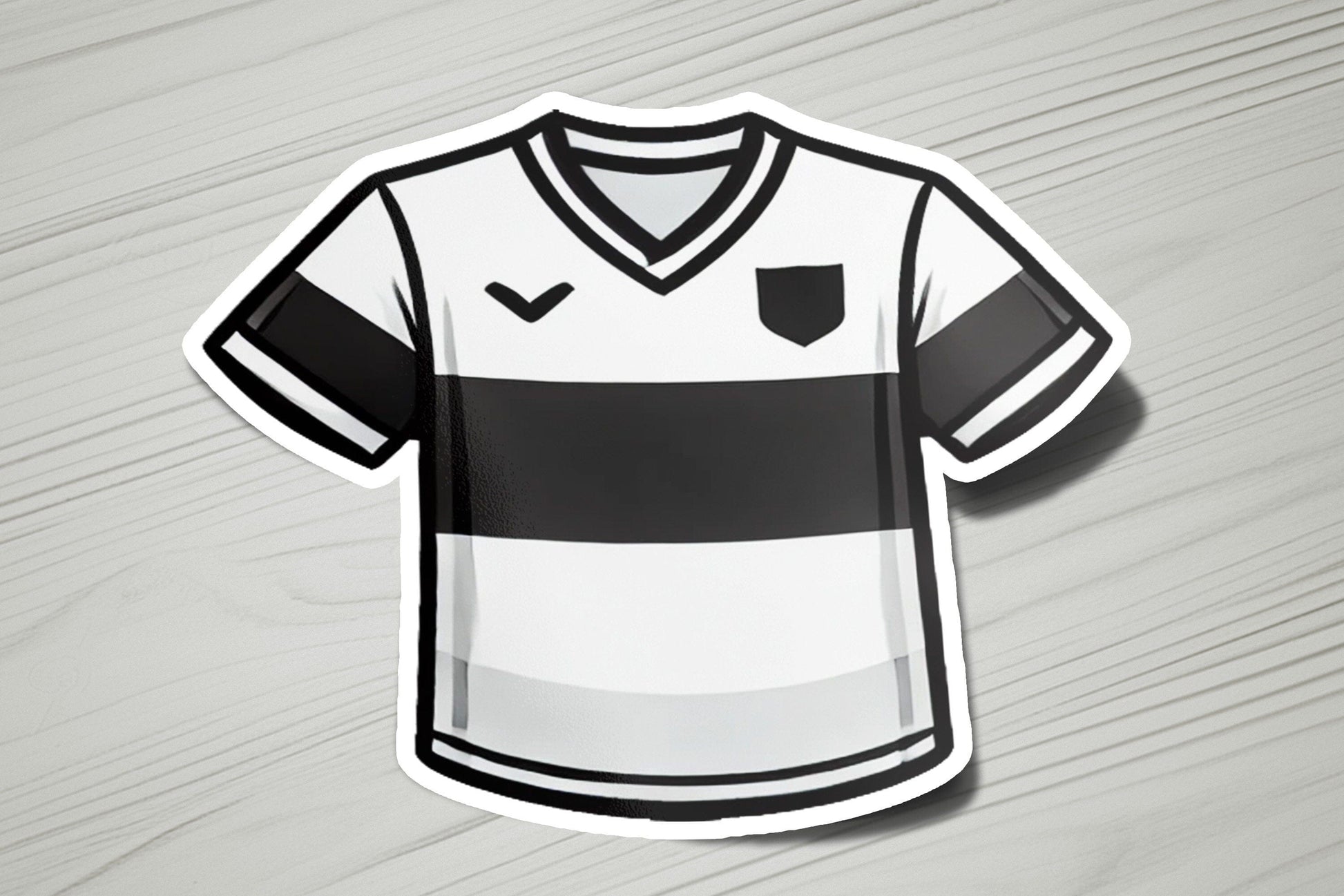a soccer jersey sticker on a wooden surface