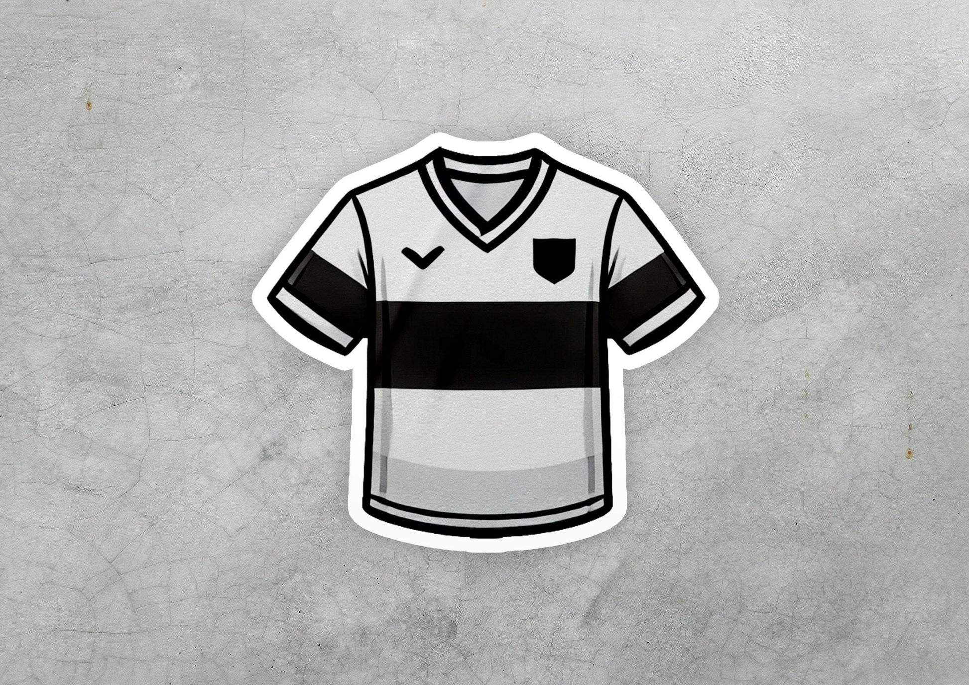 a sticker of a soccer jersey on a concrete surface