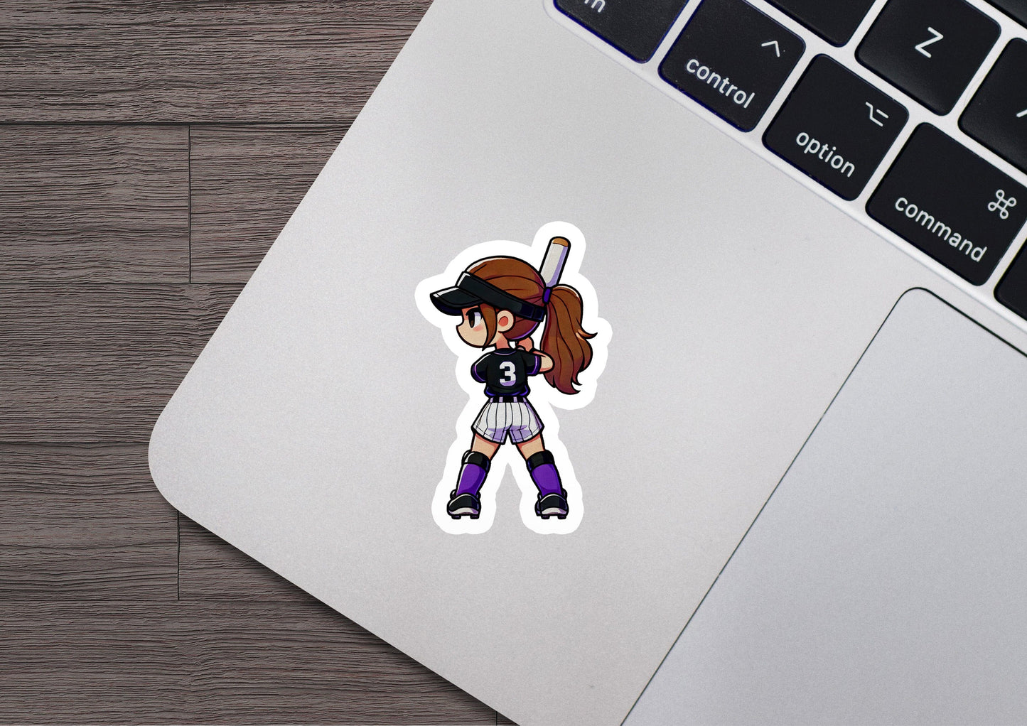 a sticker of a girl holding a baseball bat