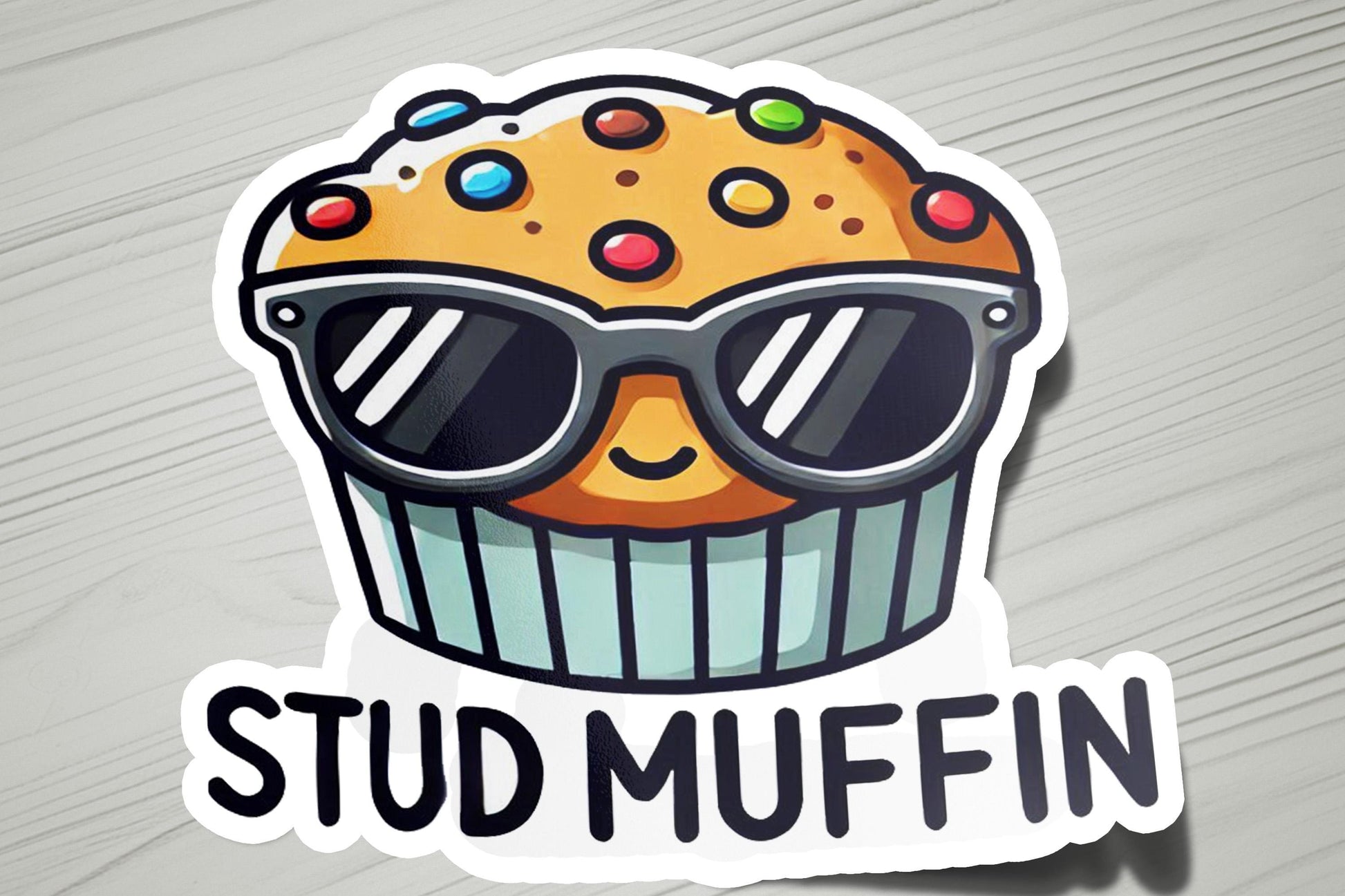 a sticker with a muffin wearing sunglasses