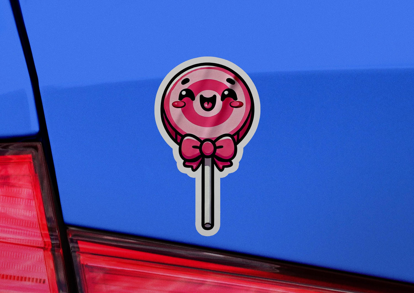 a sticker of a pink lollipop with a bow on it