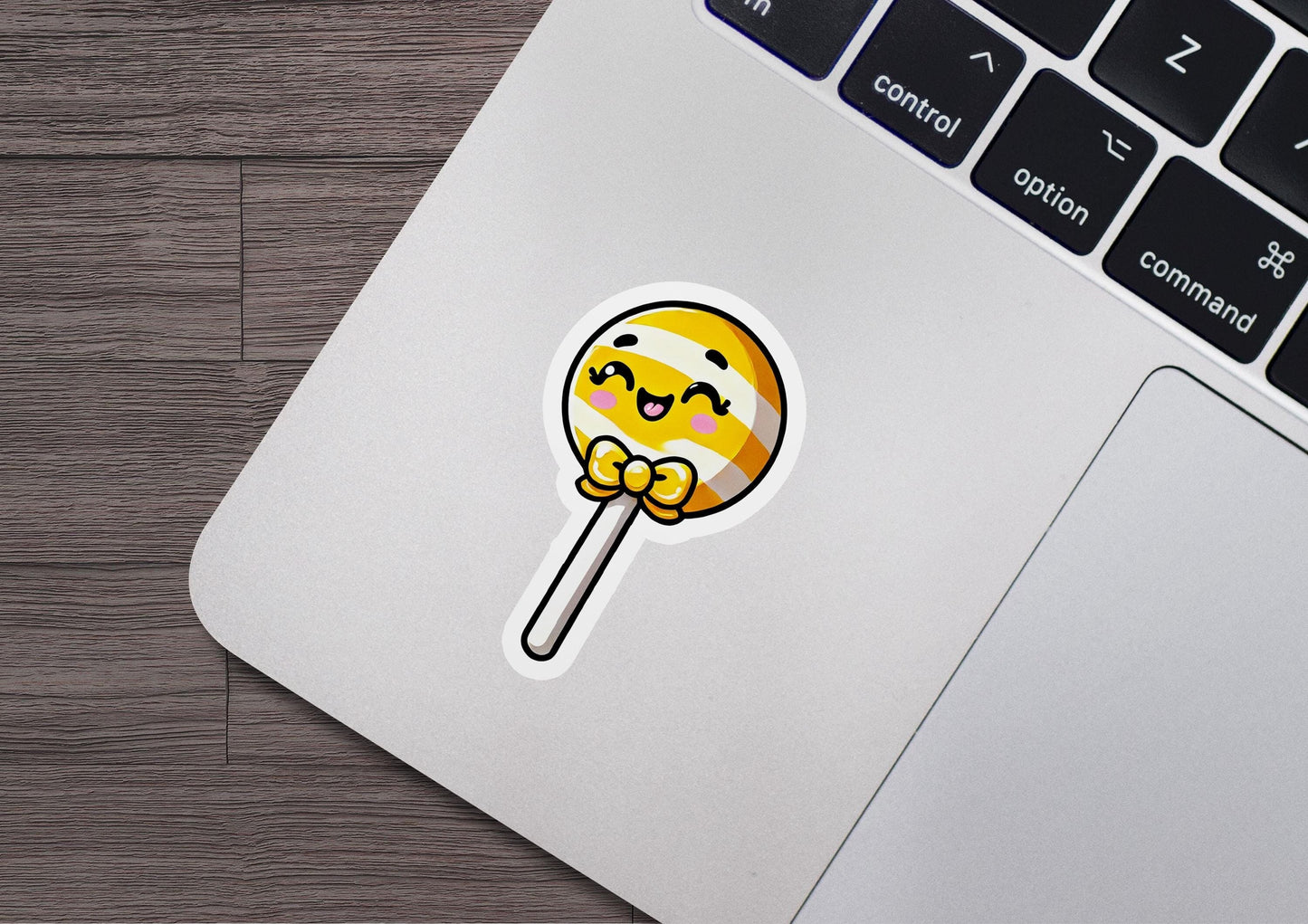 a laptop with a sticker of a lollipop