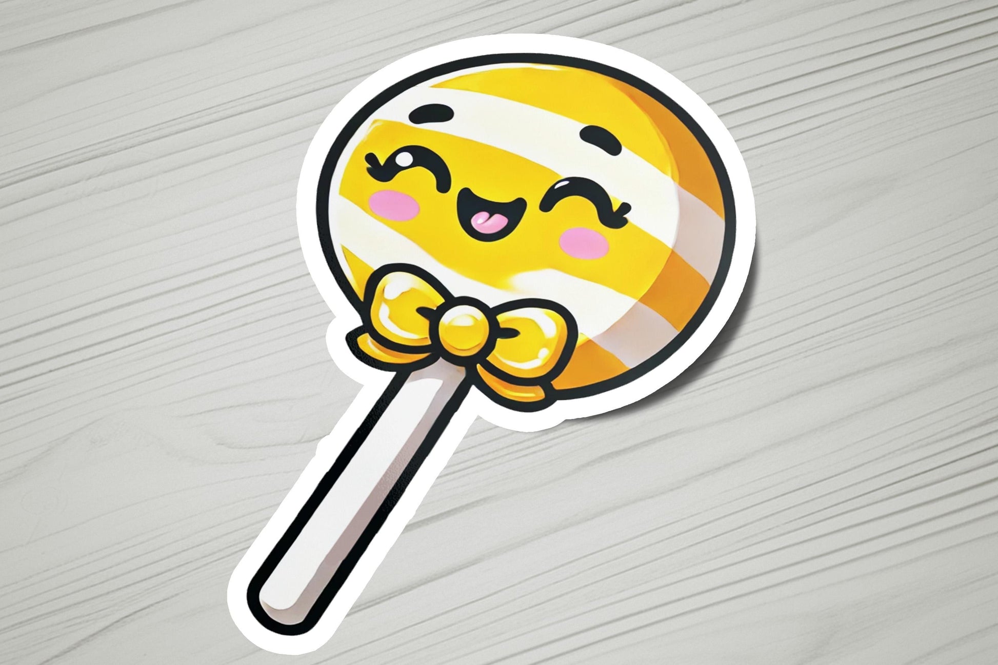 a sticker of a lollipop with a smiley face