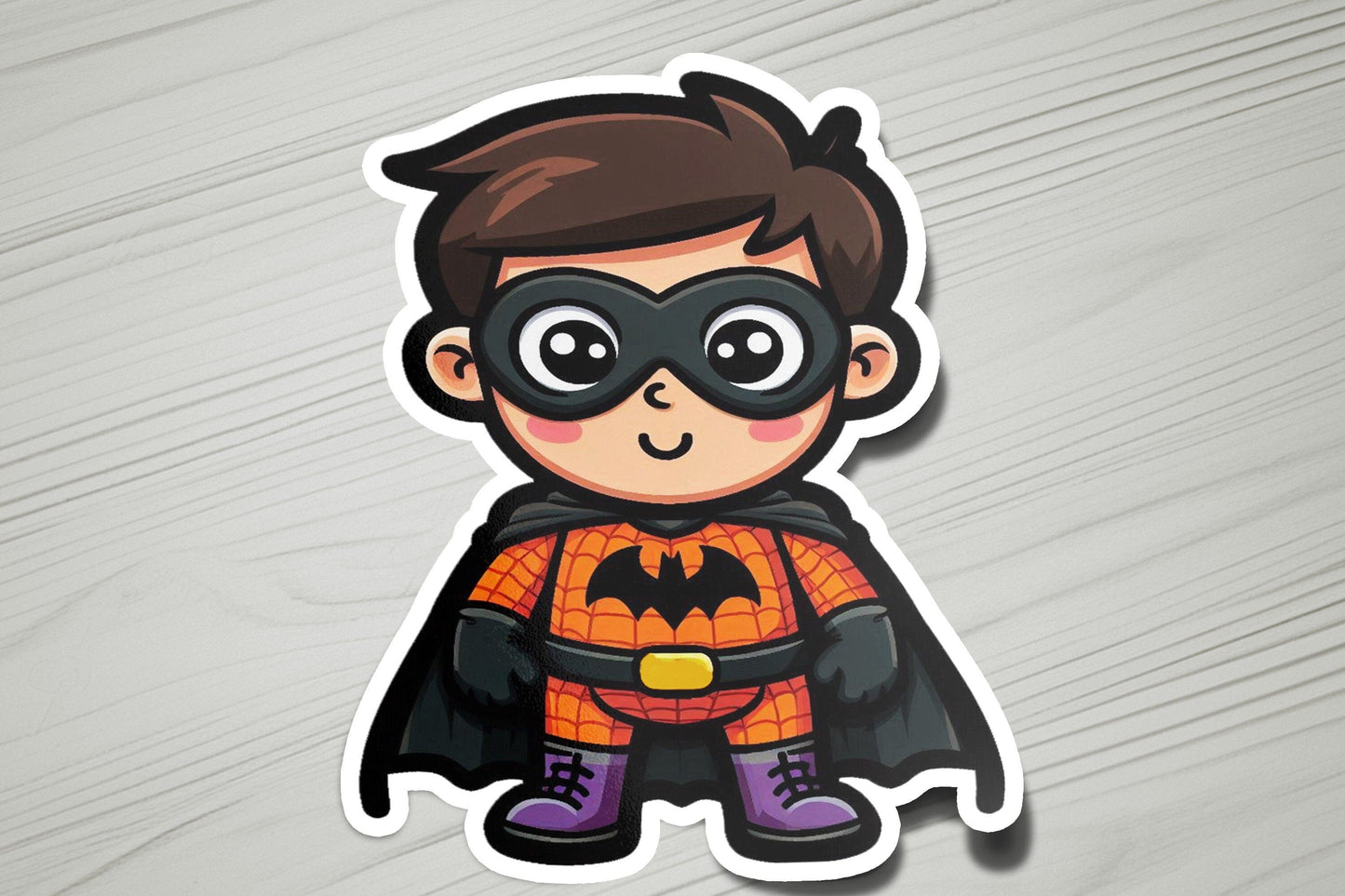 a sticker of a boy in a batman costume