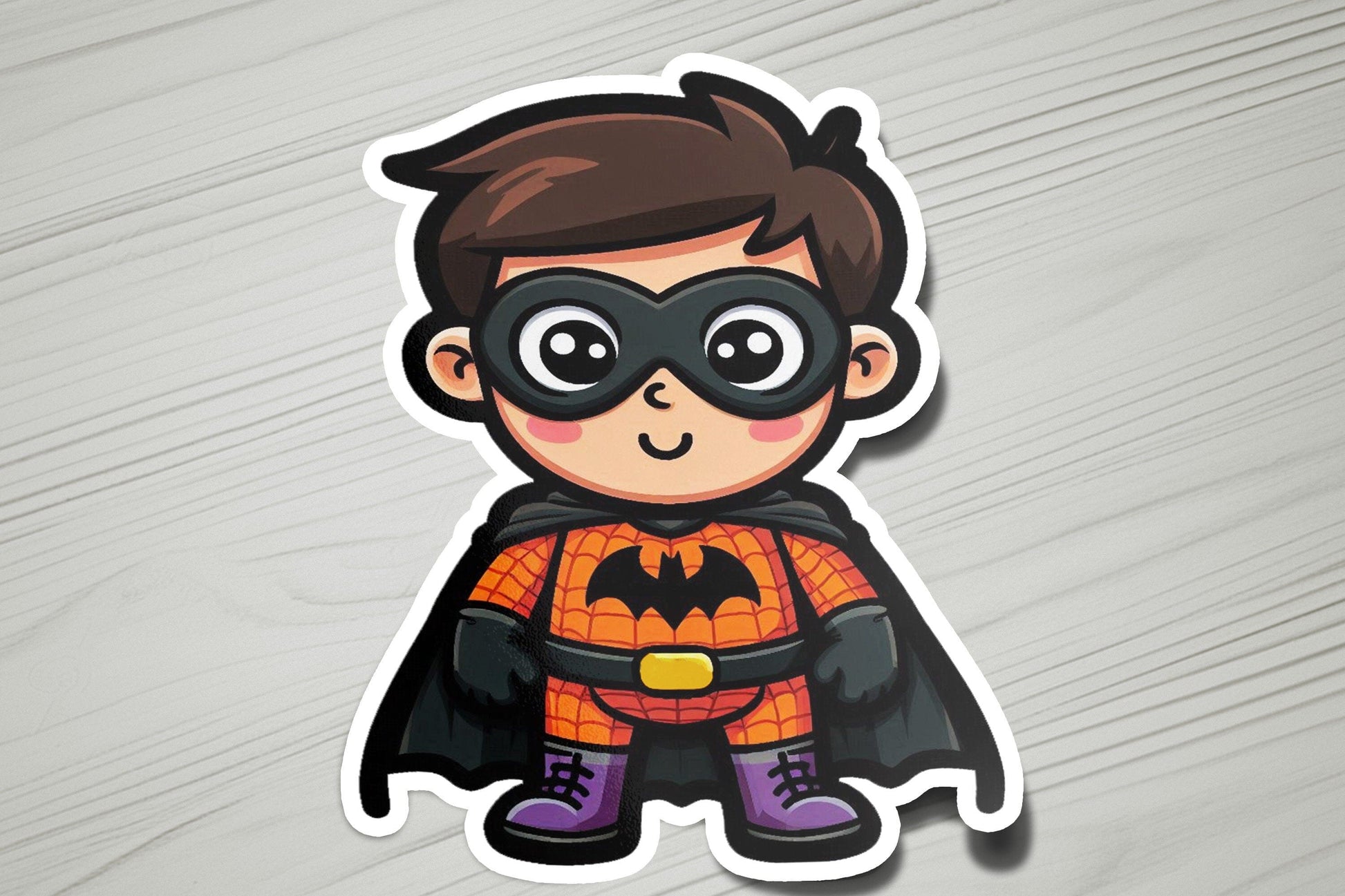 a sticker of a boy in a batman costume