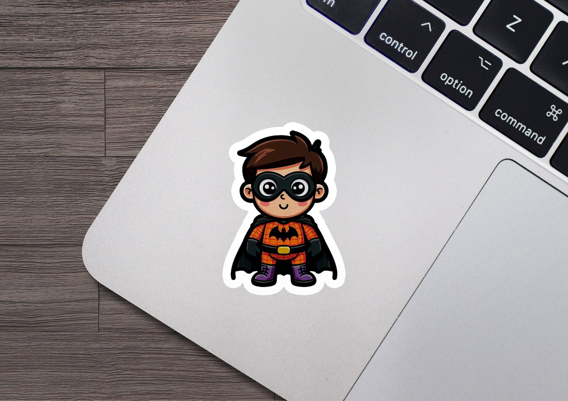 a sticker of a little boy dressed as a bat