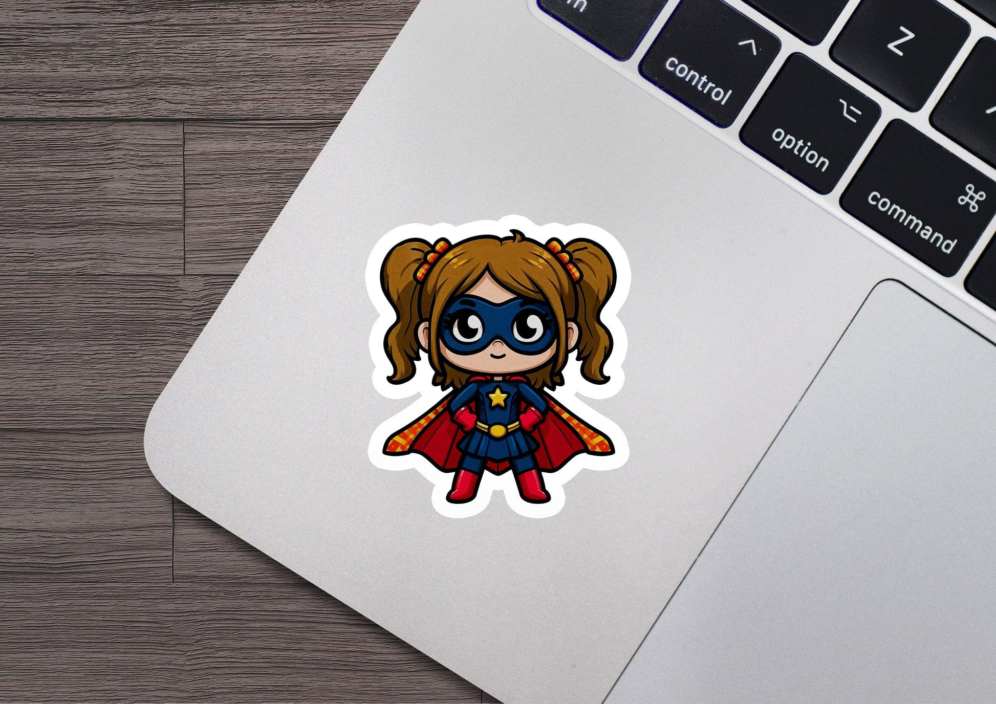 a sticker of a little girl with a cape