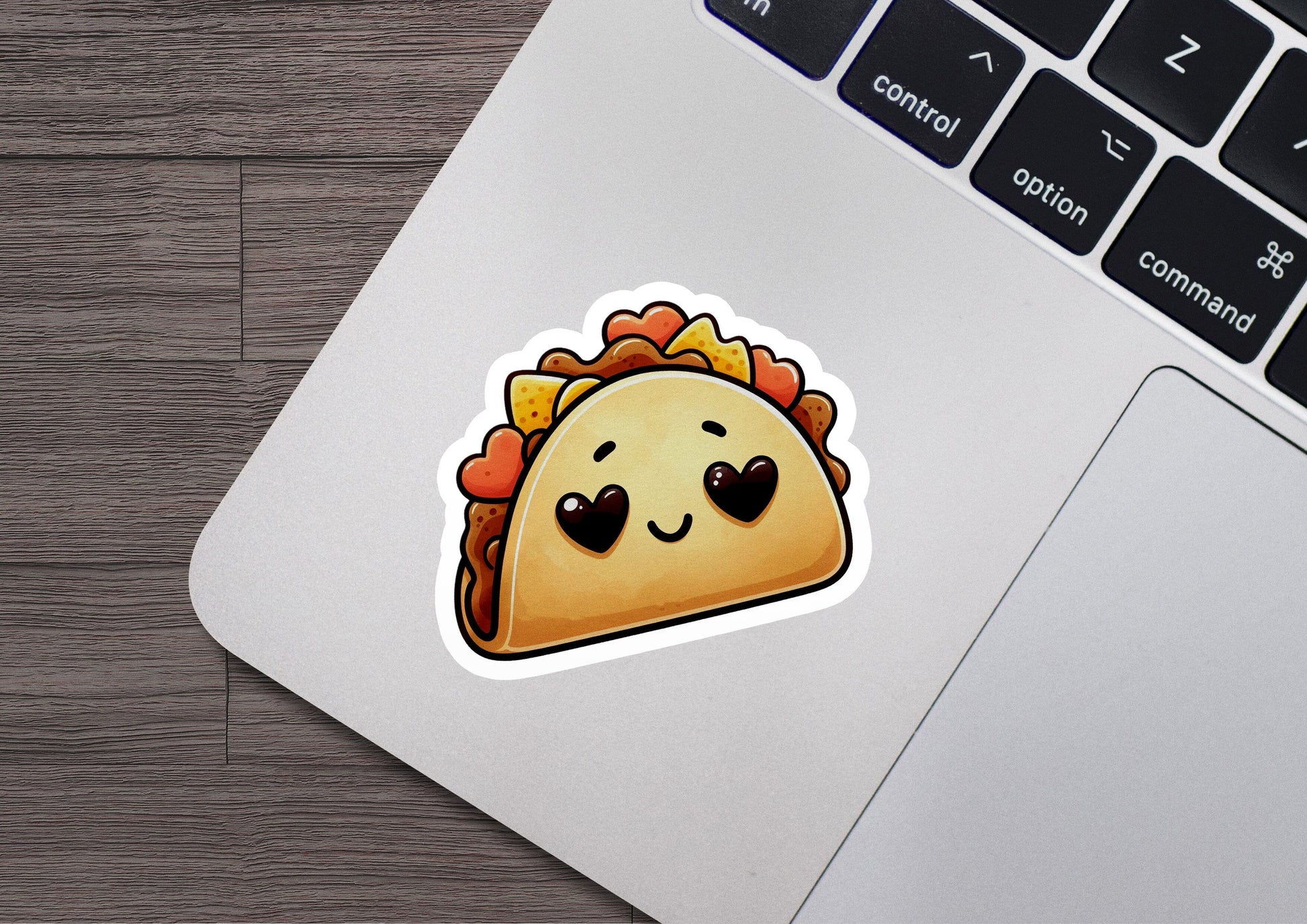 a sticker of a taco sitting on top of a laptop