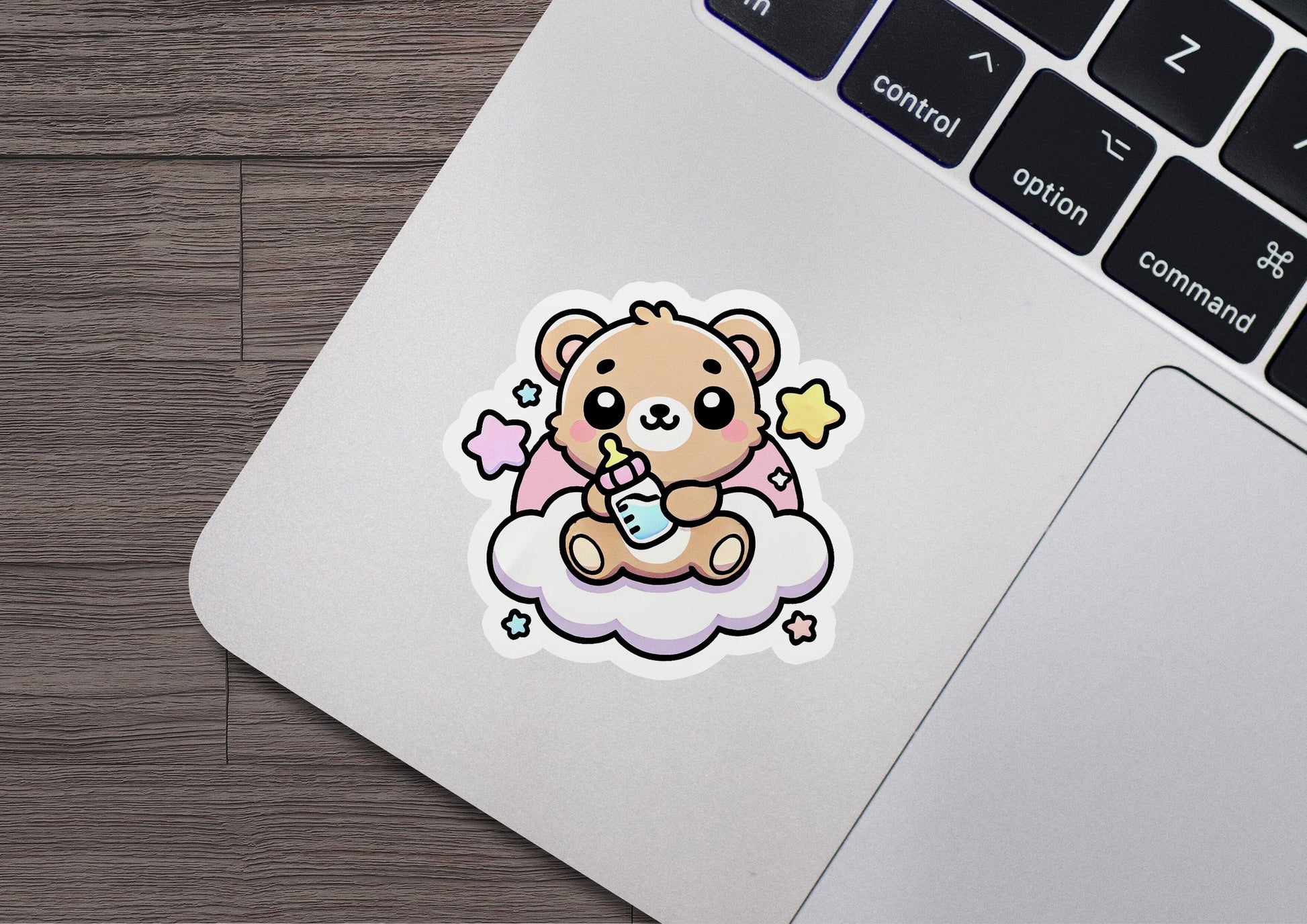 a sticker of a teddy bear sitting on a cloud