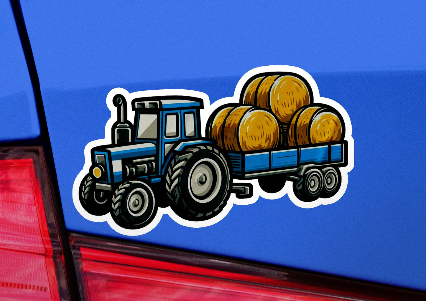 a blue truck with a load of hay on the back of it