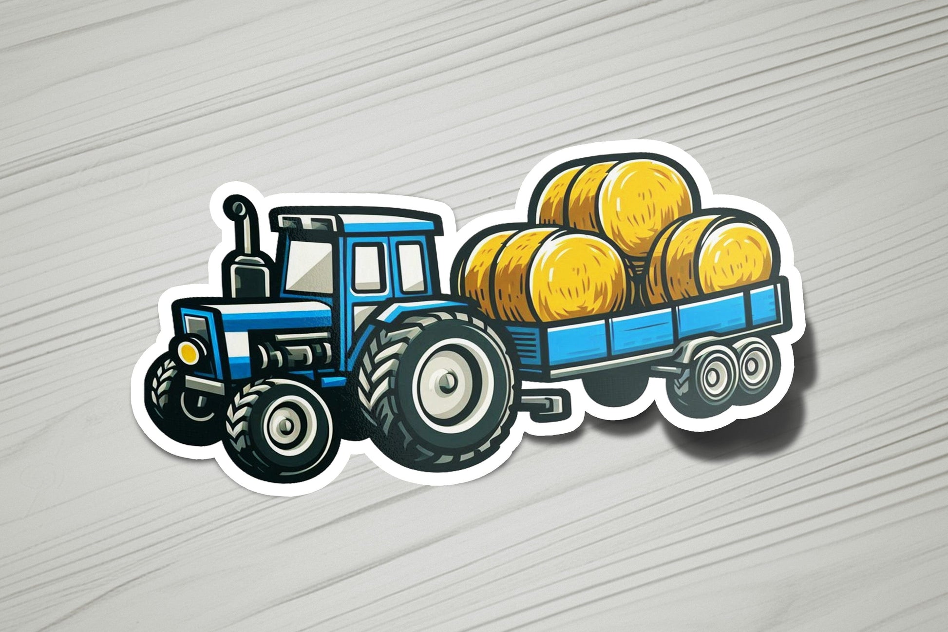 a sticker of a tractor with bales of hay