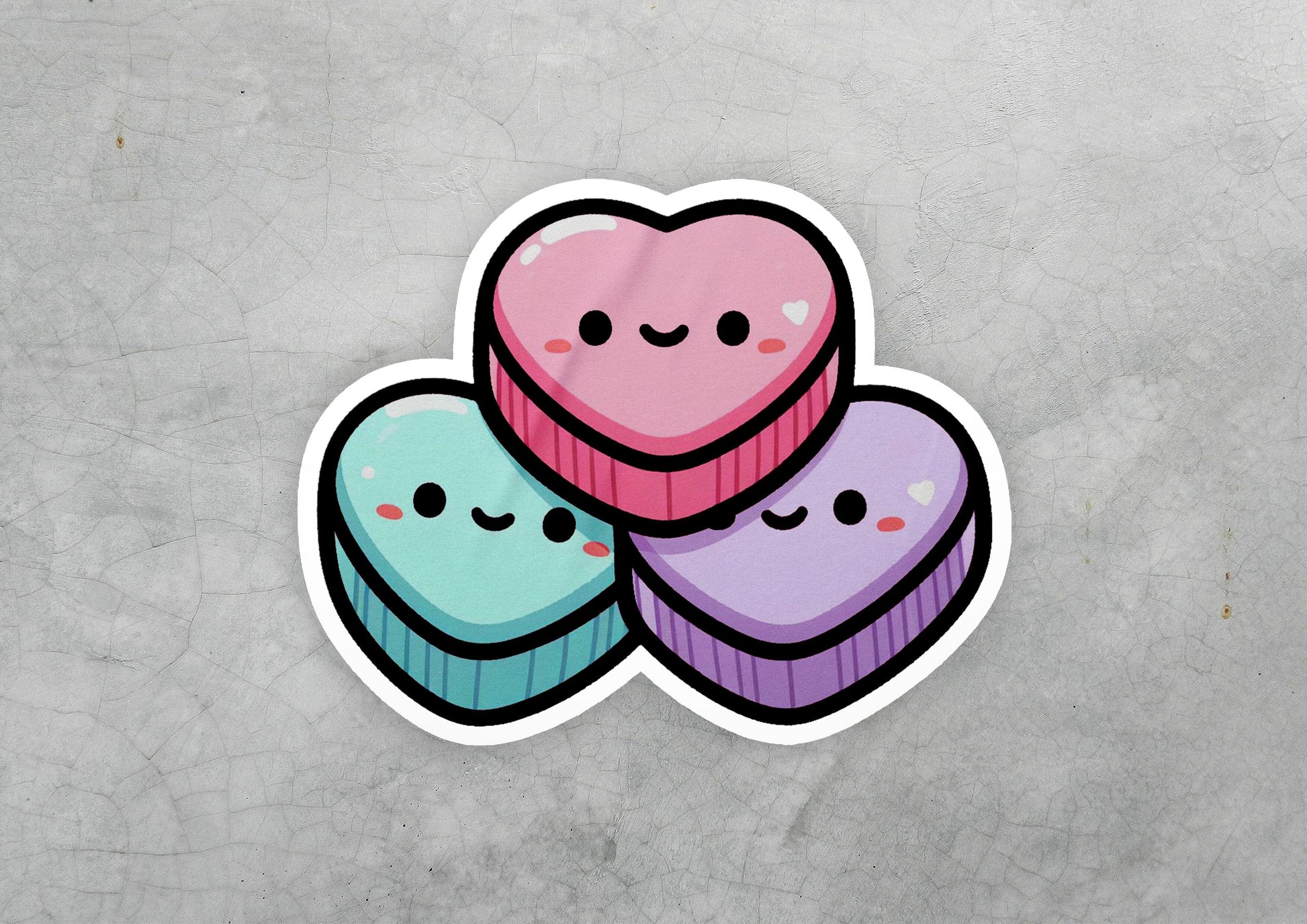 a sticker of three heart shaped cupcakes