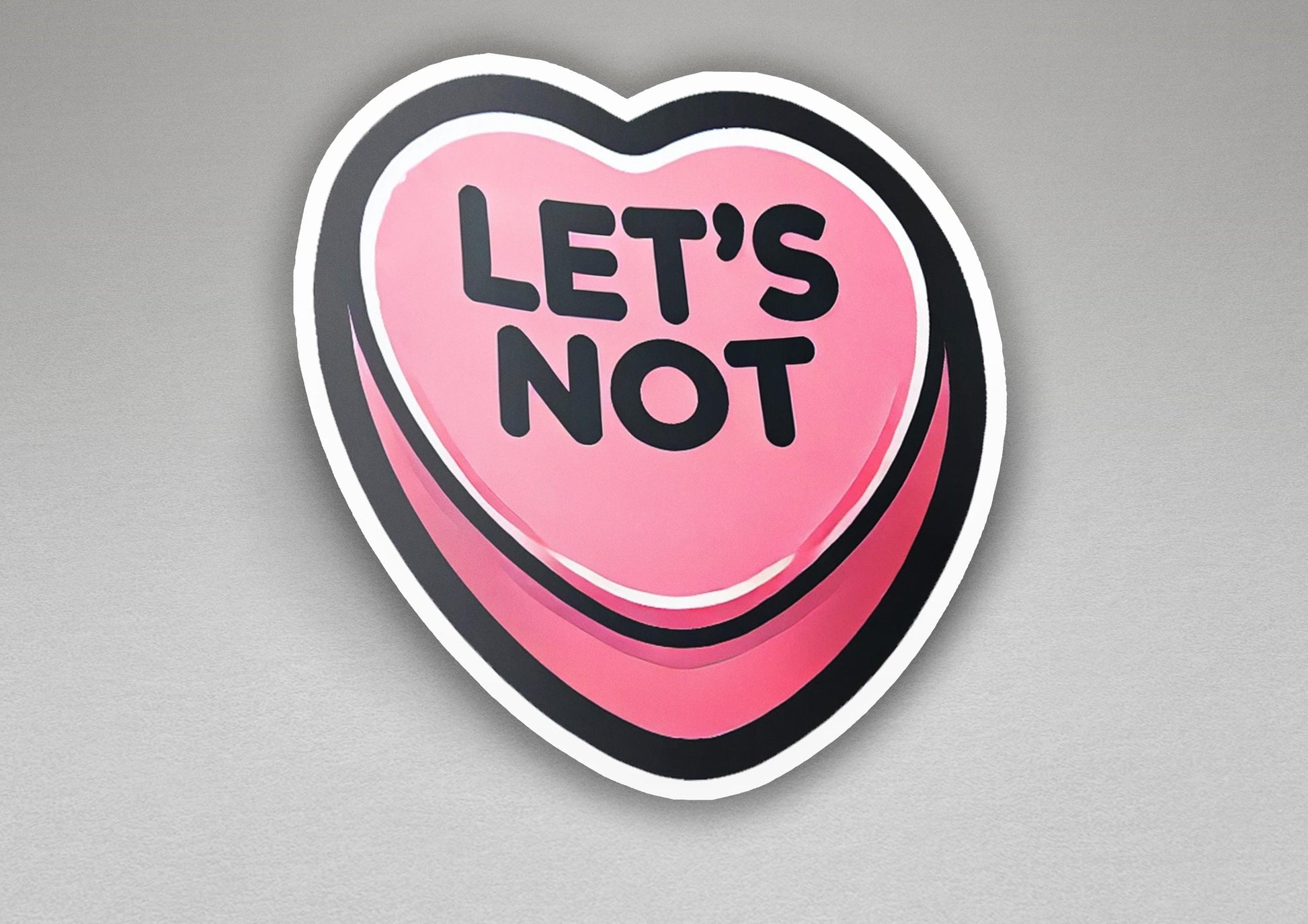 a heart shaped sticker that says let's not