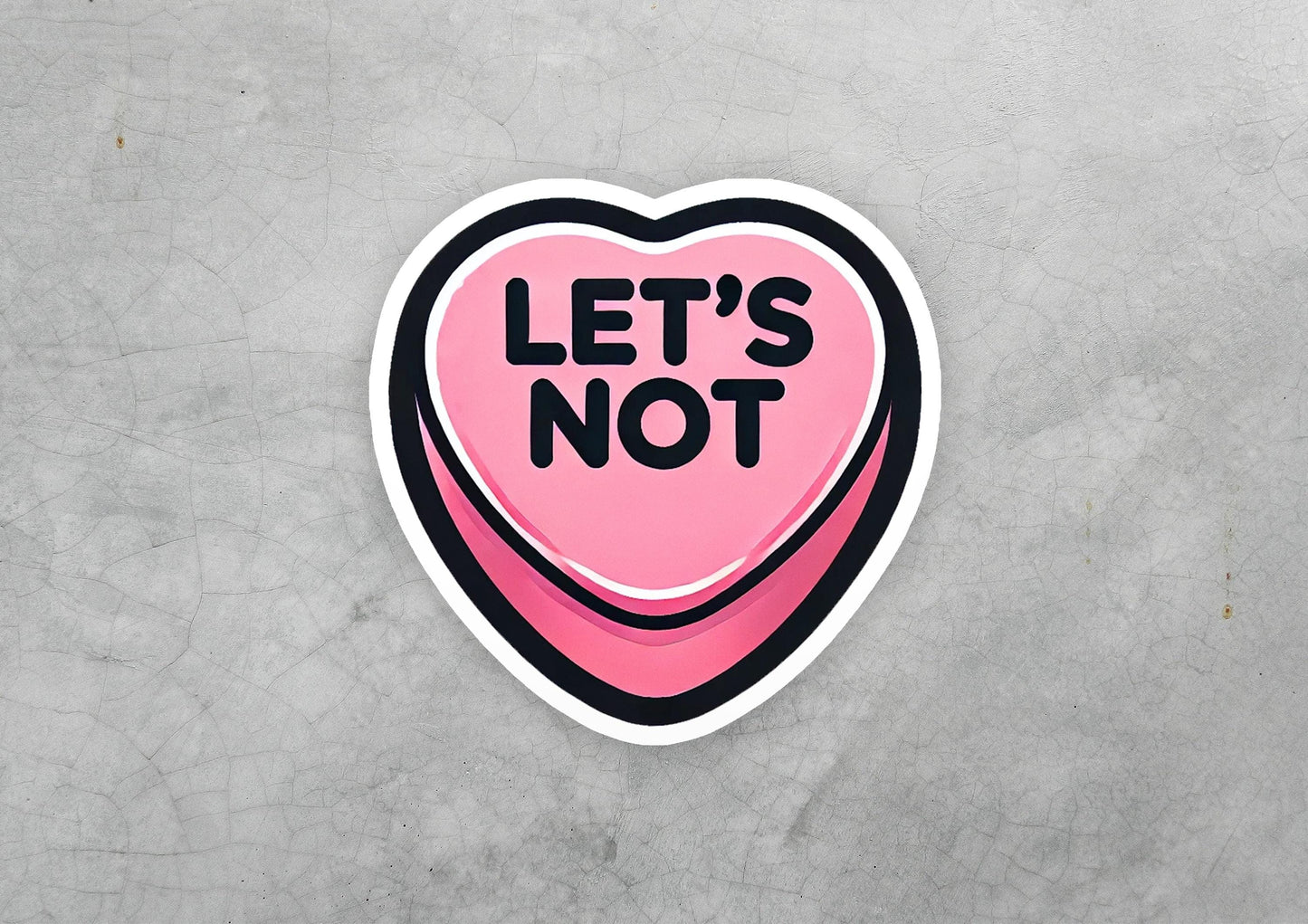 a pink heart shaped sticker that says let's not
