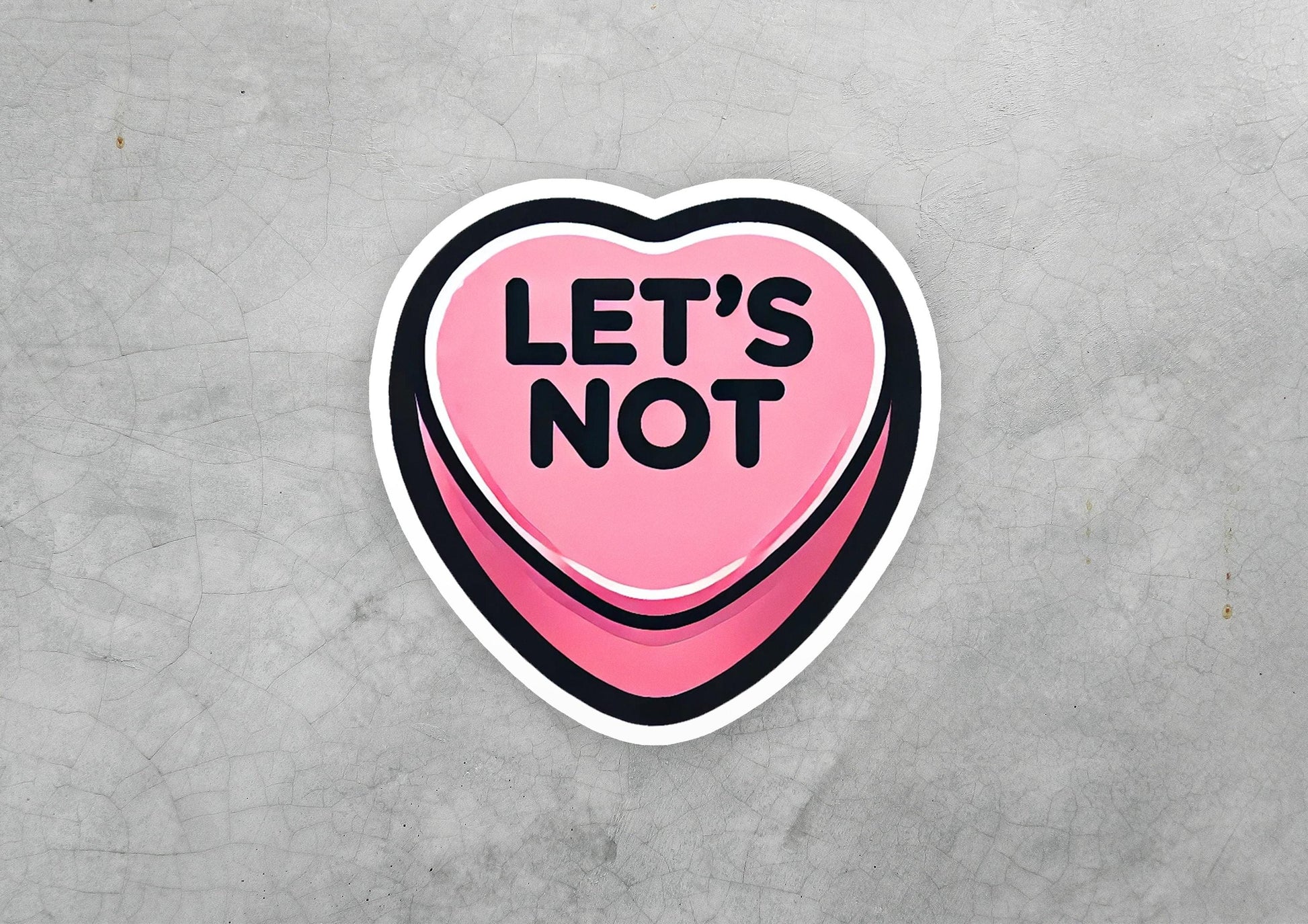 a pink heart shaped sticker that says let's not