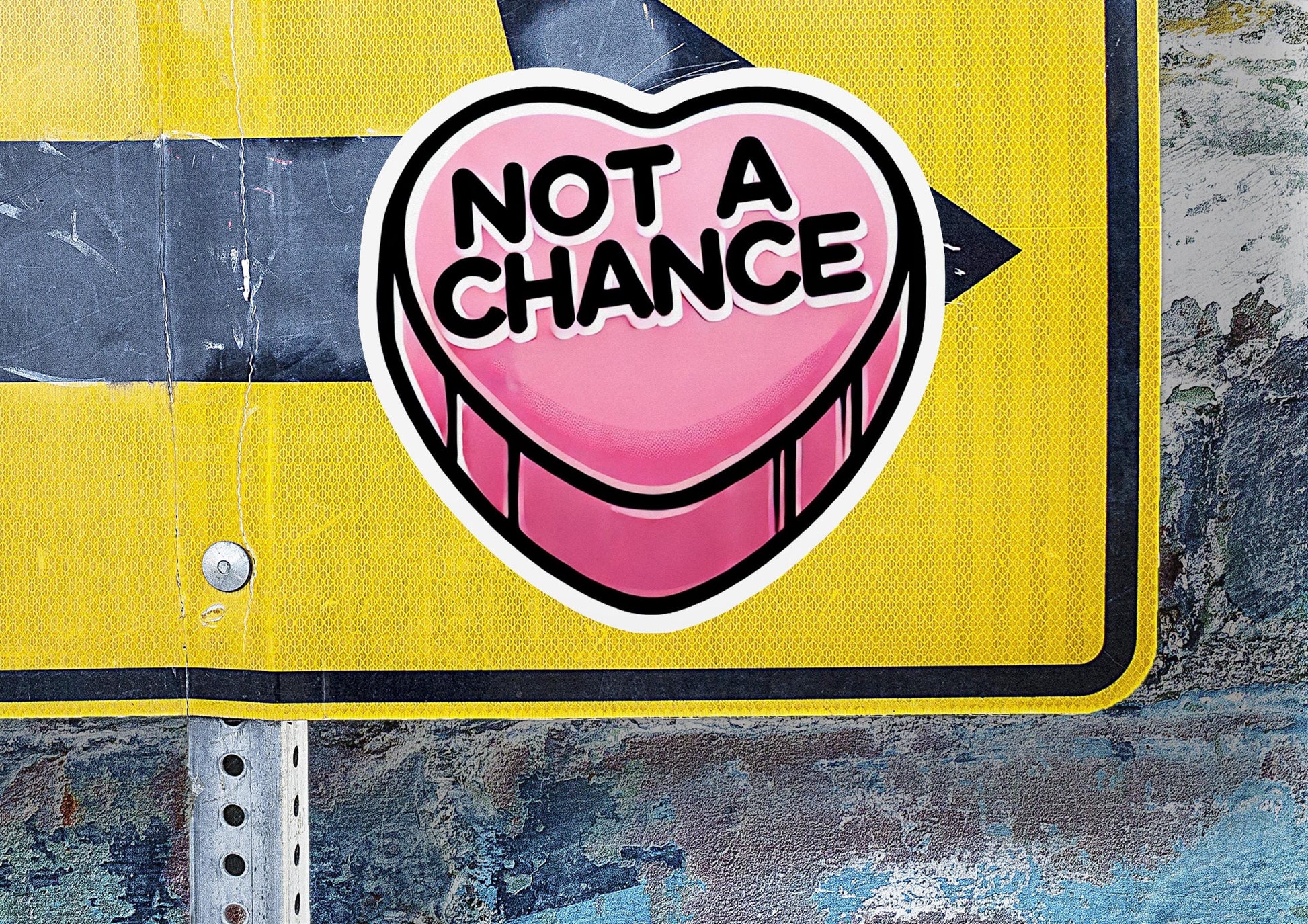 a street sign with a heart shaped sticker on it