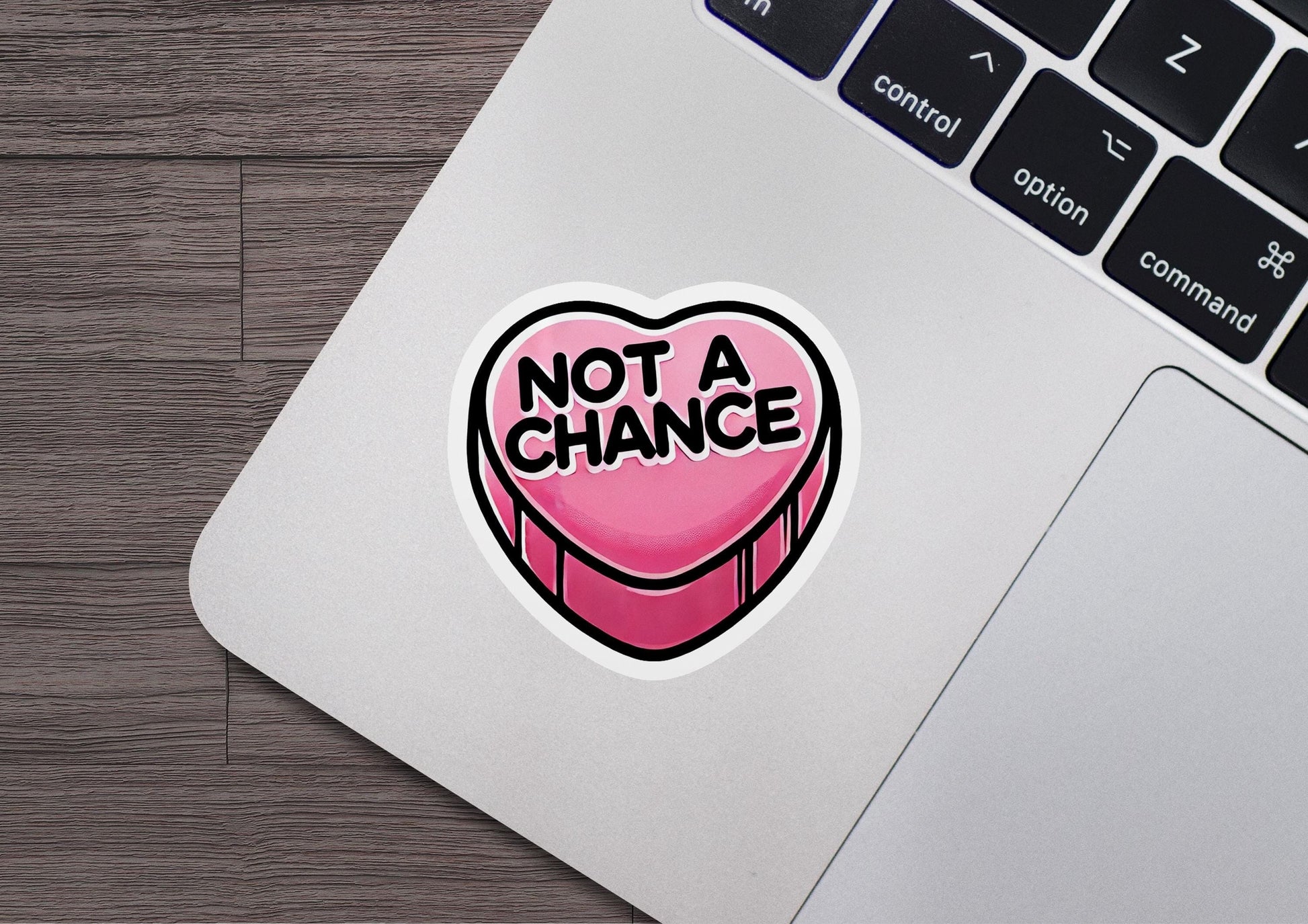 a sticker that says not a chance on a laptop