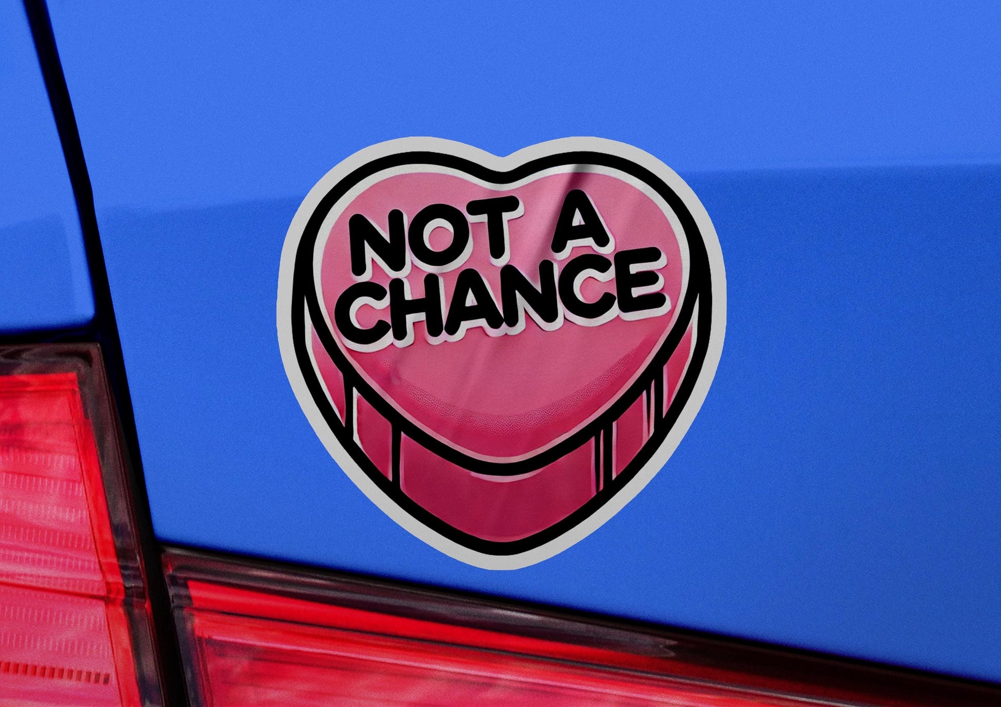 a sticker that says not a chance on the back of a car