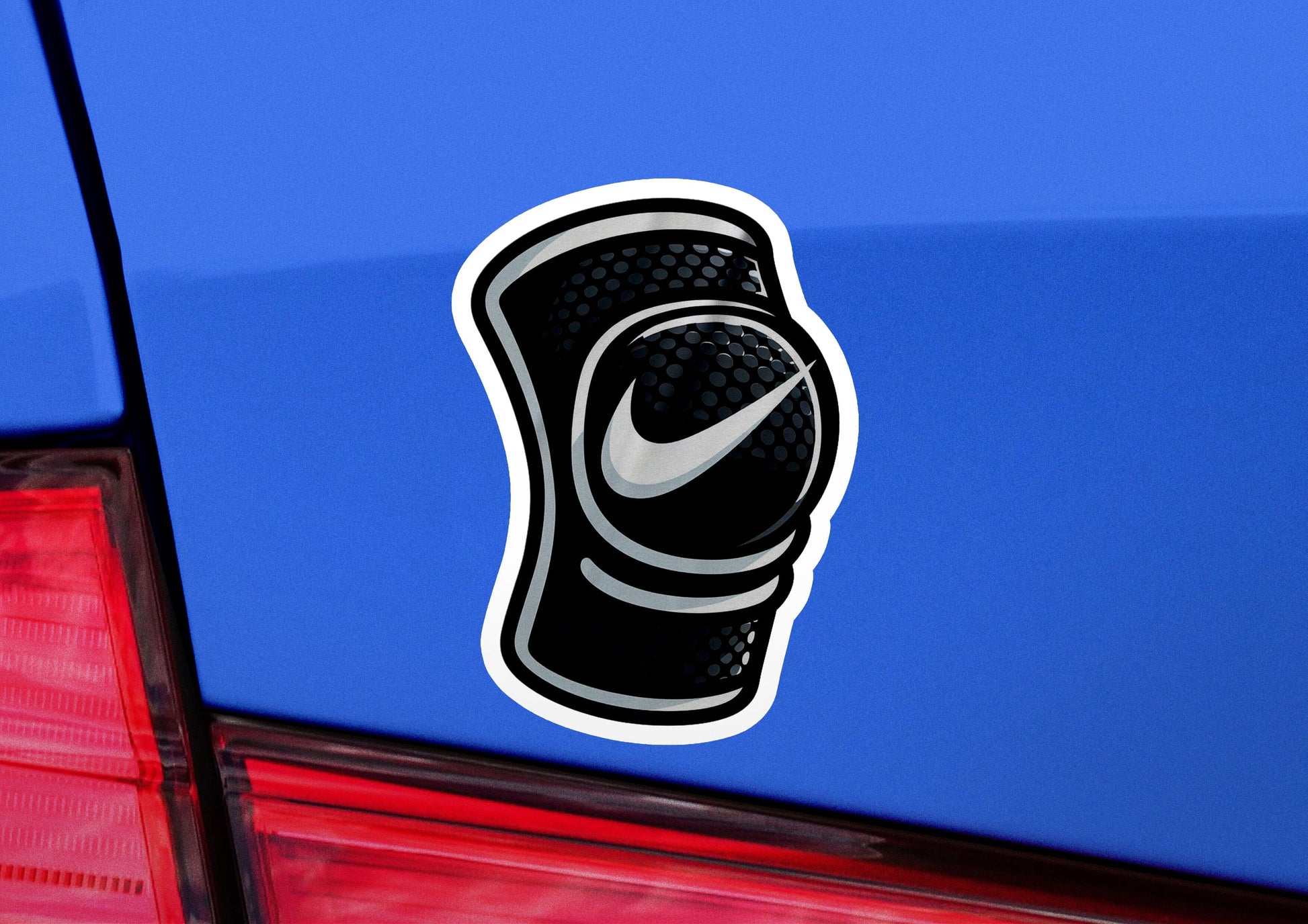 a sticker of a nike shoe on a blue car