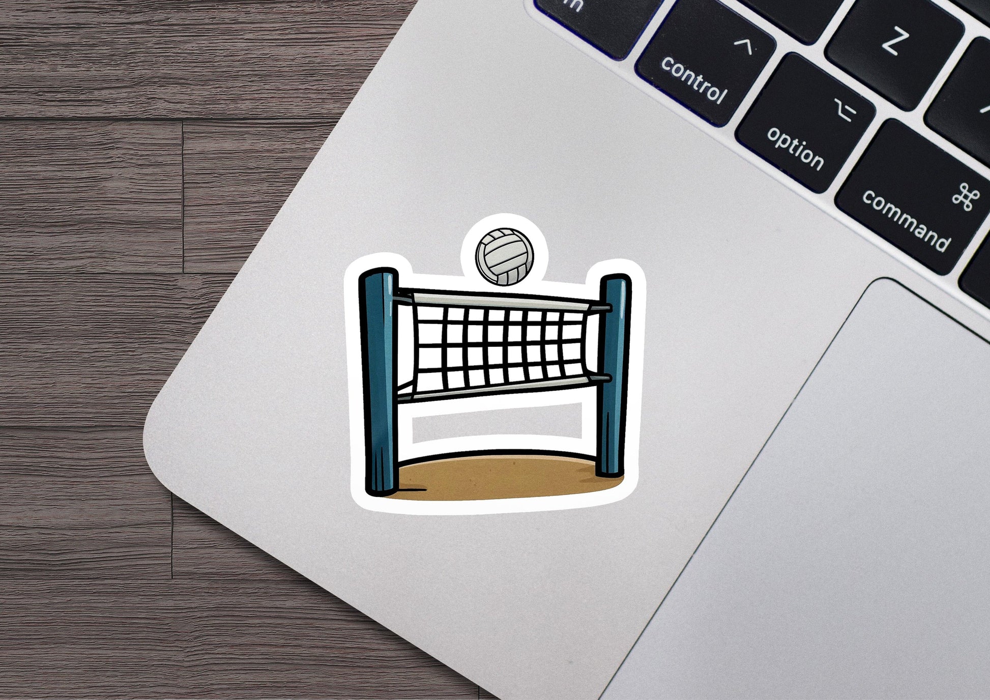 a laptop with a sticker of a volleyball net