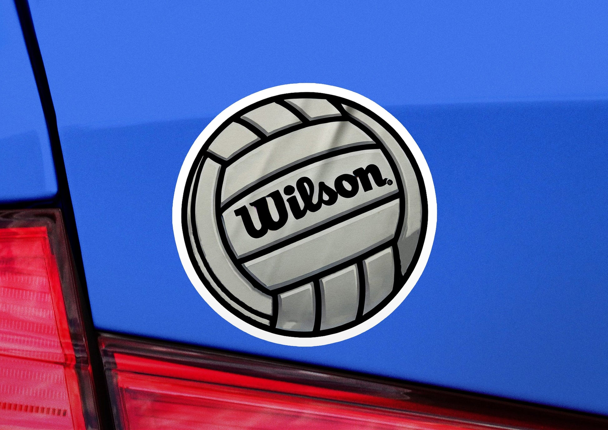 a sticker of a volleyball on the back of a car