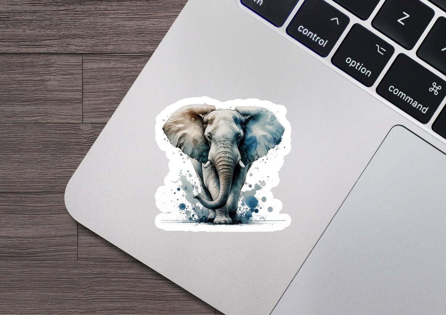an elephant sticker on a laptop keyboard