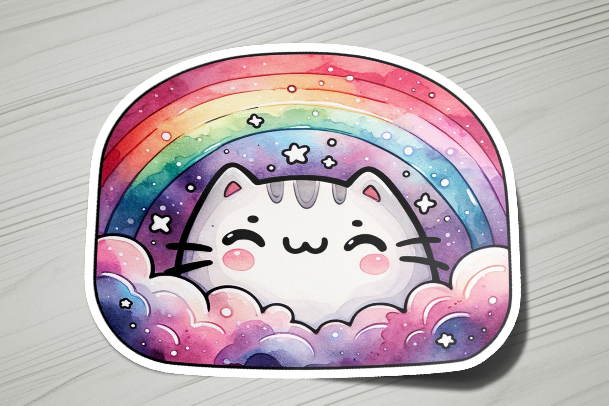 a sticker of a cat with a rainbow in the background