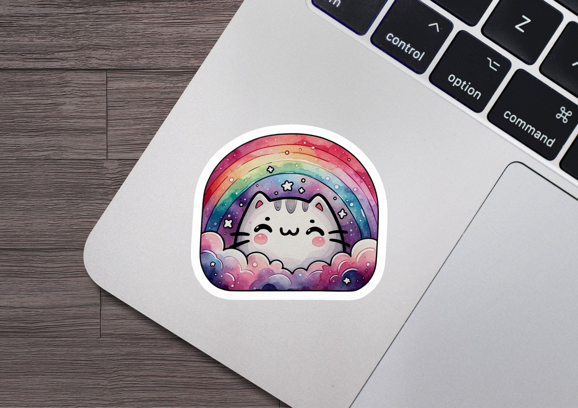a sticker of a cat with a rainbow in the background