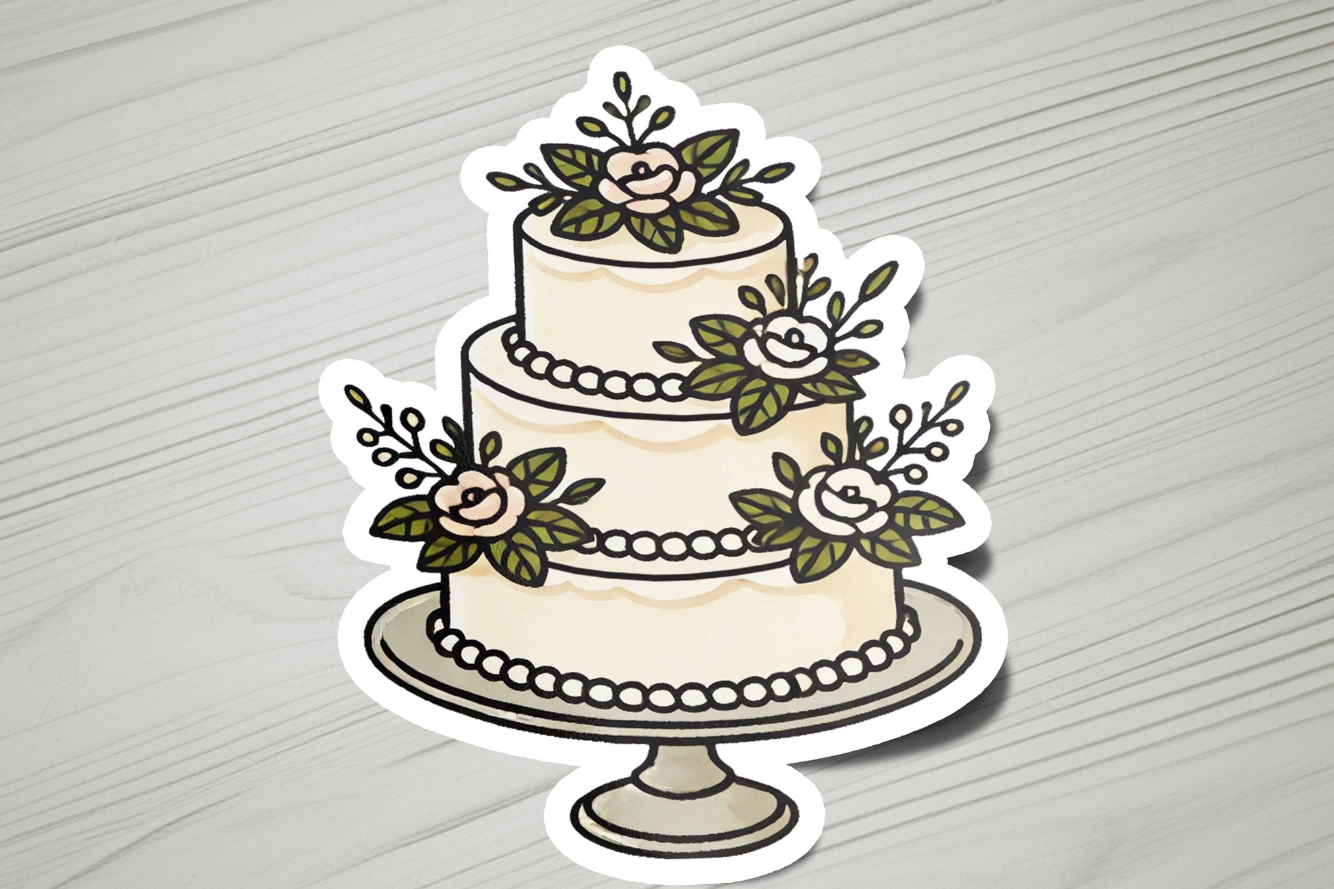 a sticker of a wedding cake with flowers on it