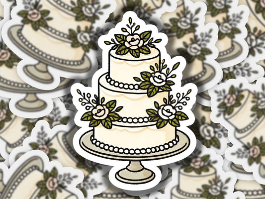 a sticker of a wedding cake with flowers on it