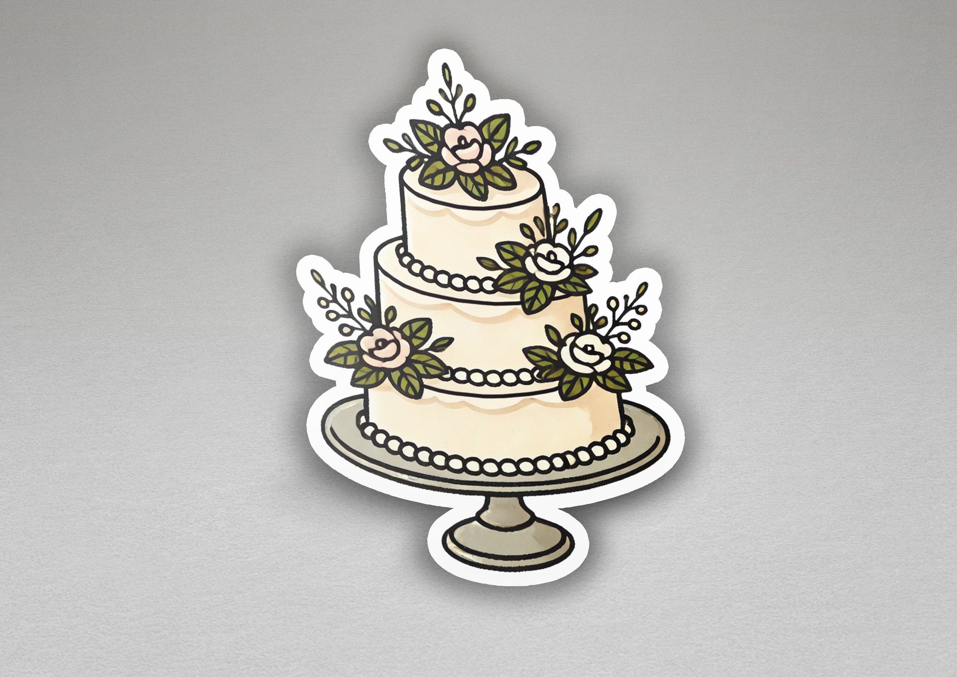 a sticker of a wedding cake with flowers on it