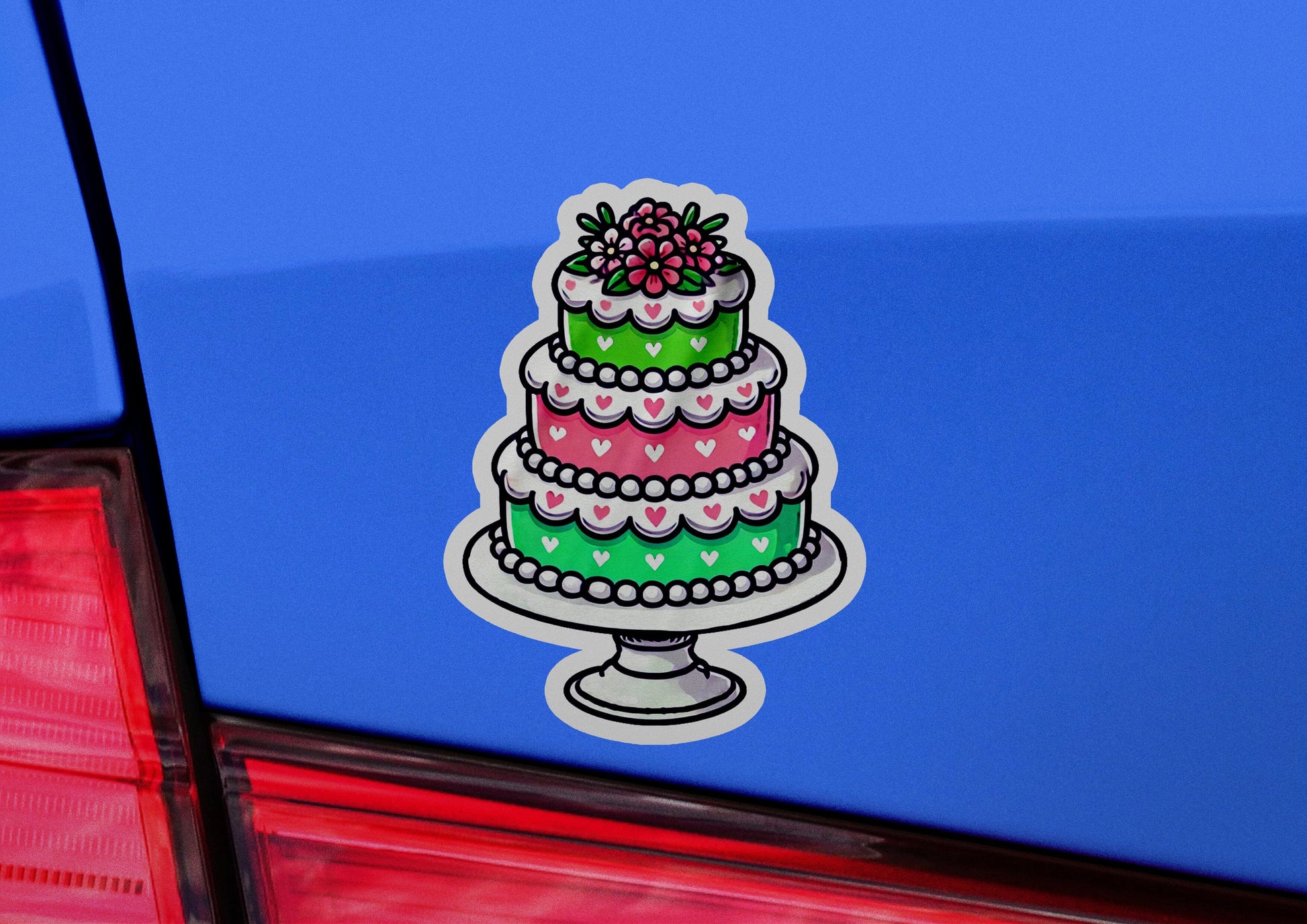 a cake sticker on the back of a car