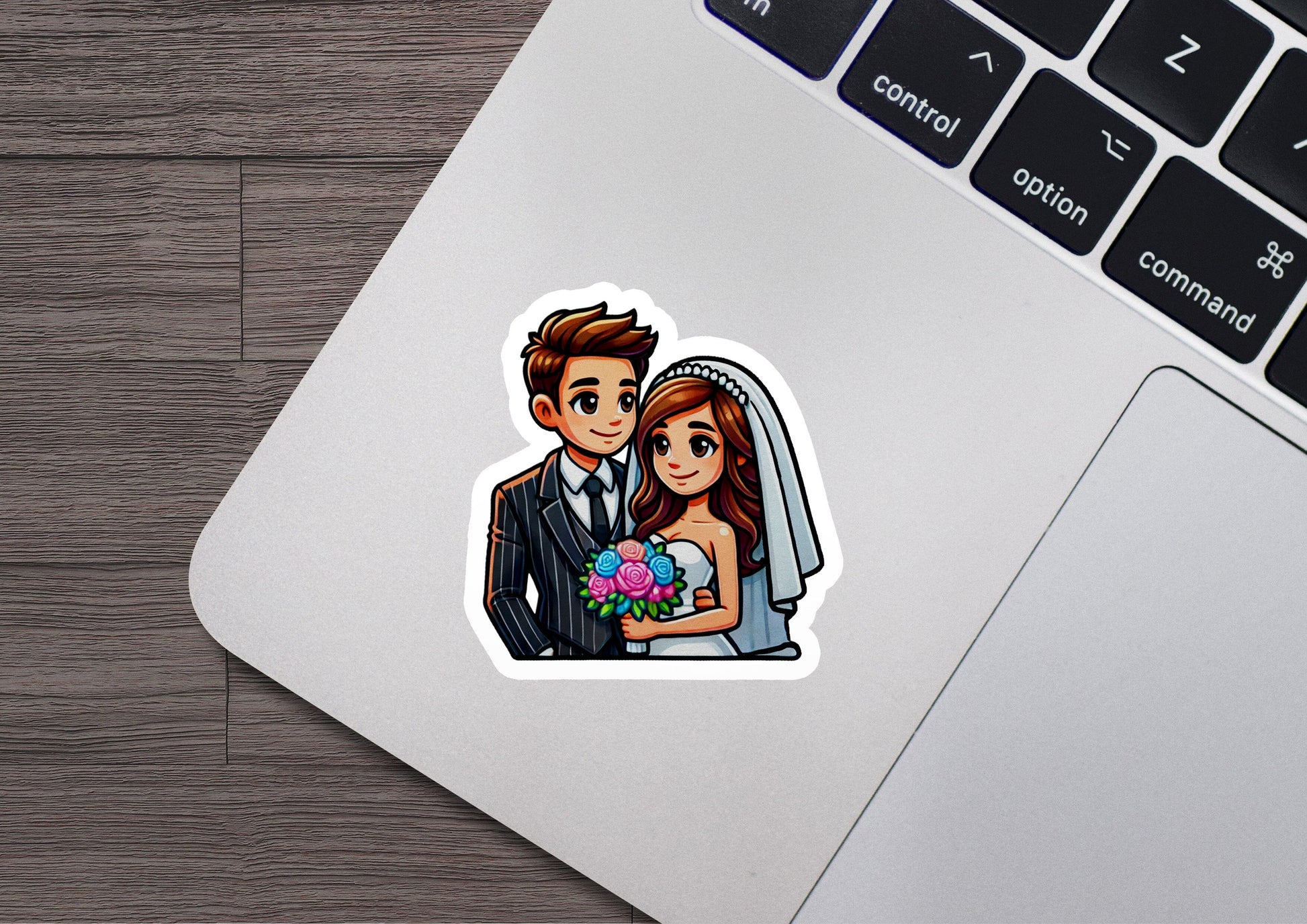 a sticker of a bride and groom on a laptop