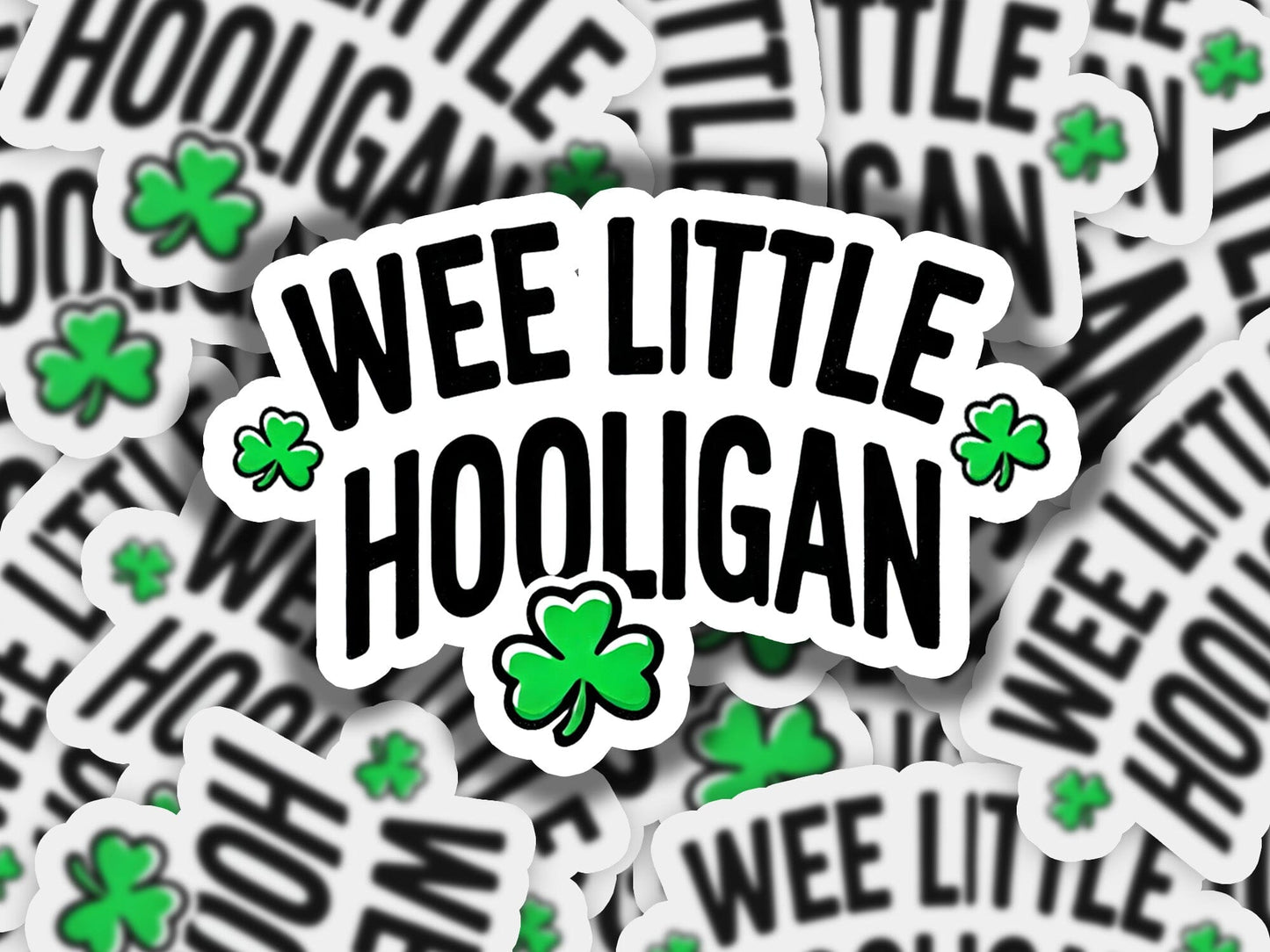 a pile of stickers with the words wee little hooligan