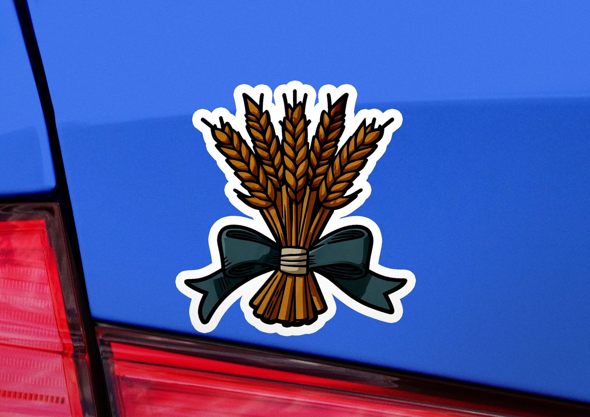 a sticker of a bunch of wheat on the back of a car