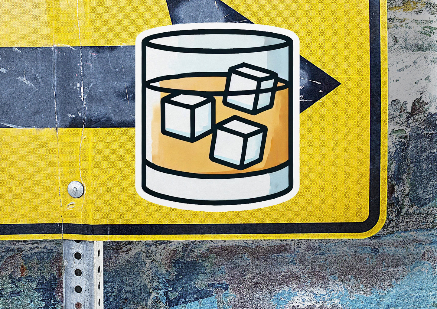 a close up of a street sign with a drink on it