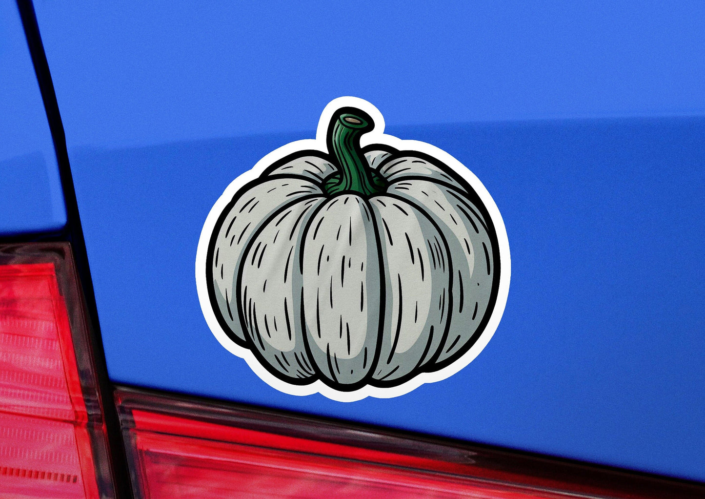 a sticker of a pumpkin on the back of a car