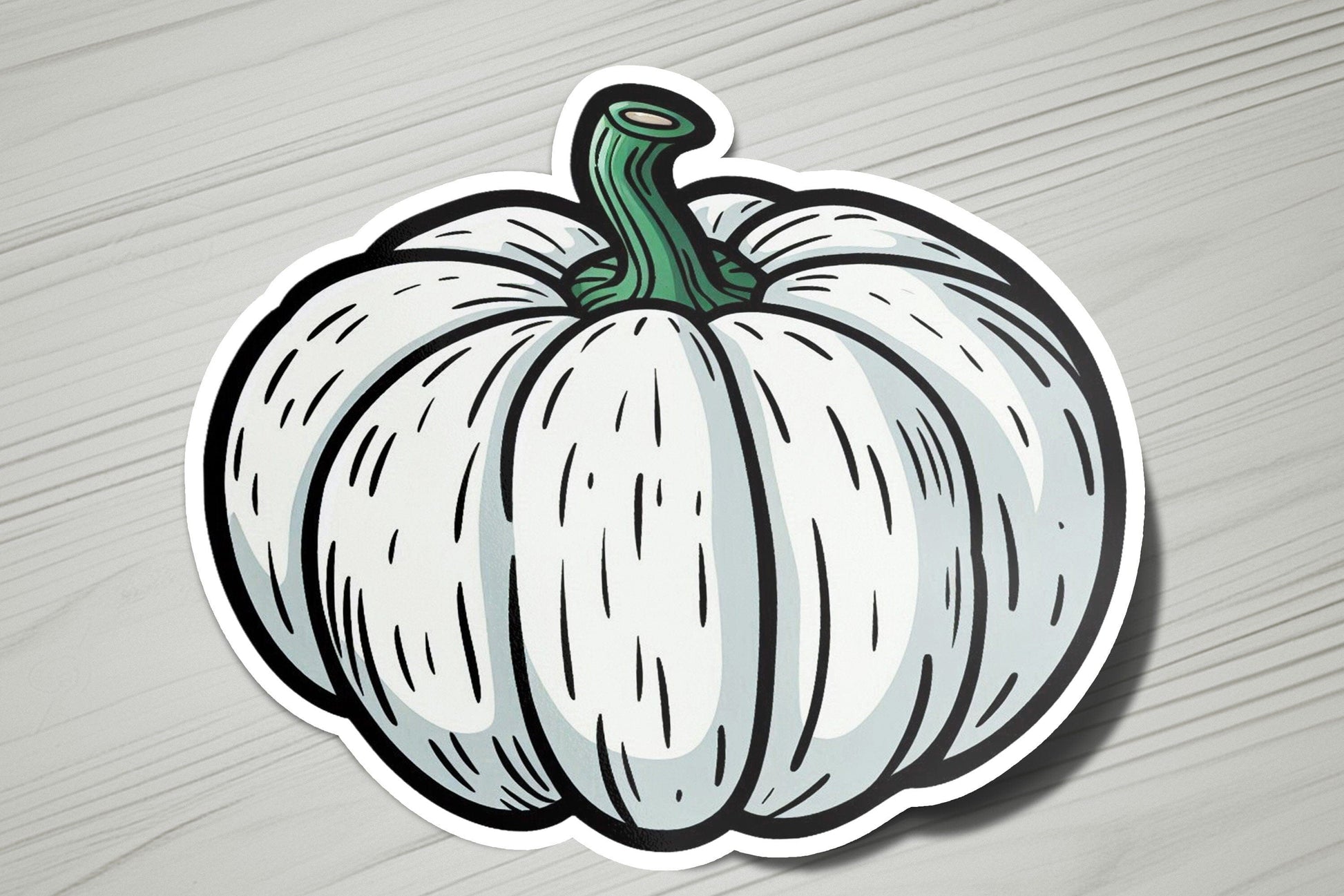 a sticker of a white pumpkin on a wooden surface