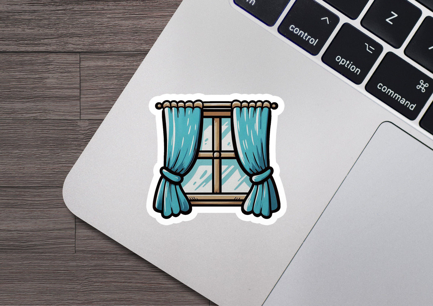a laptop computer with a sticker of a window