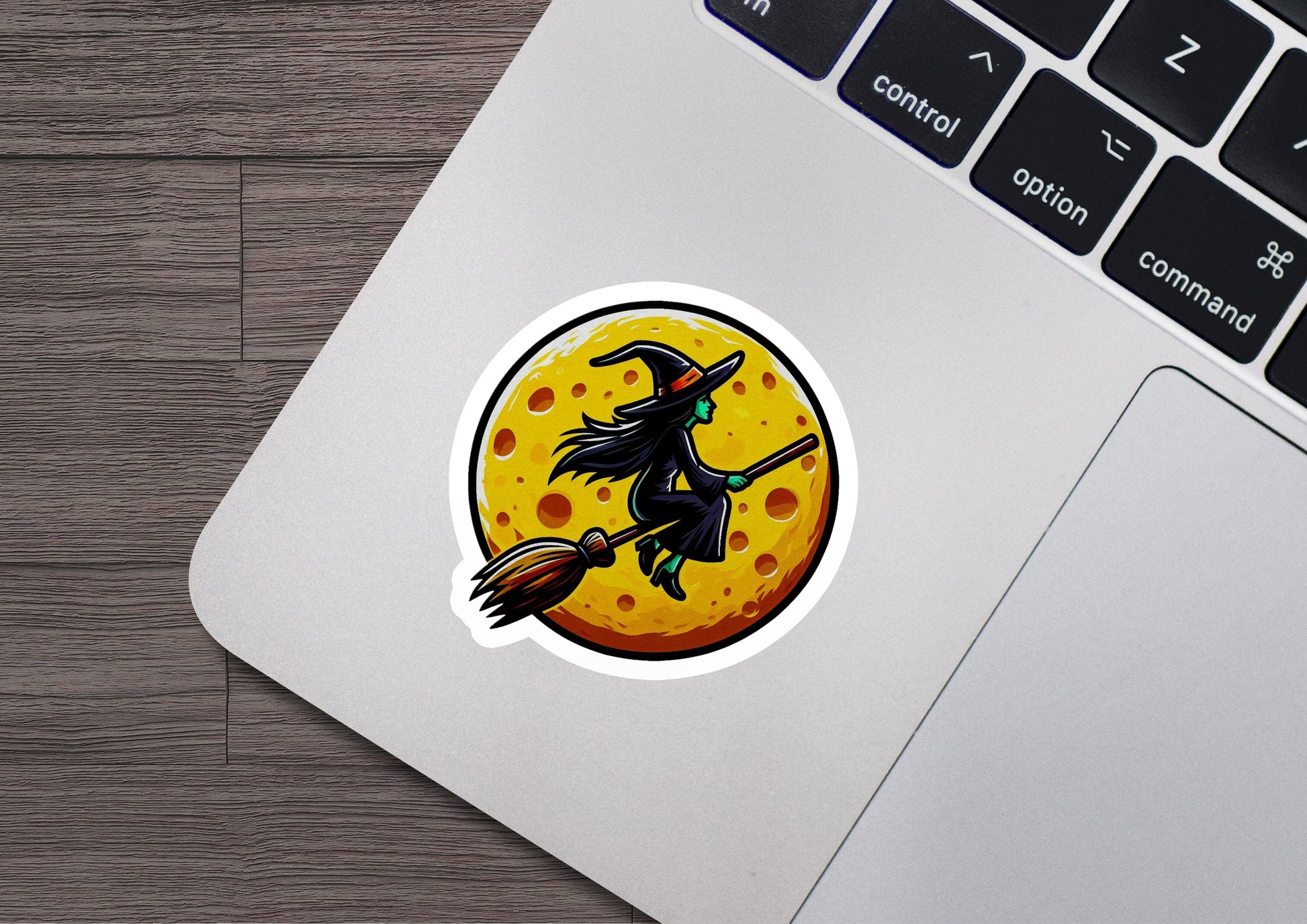 a sticker of a witch flying on a broom