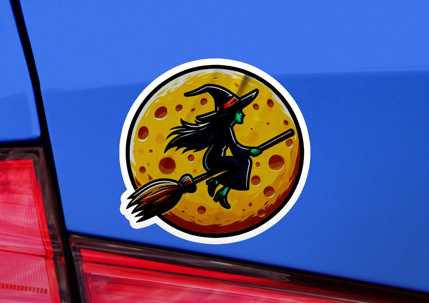 a sticker of a witch flying on a broom