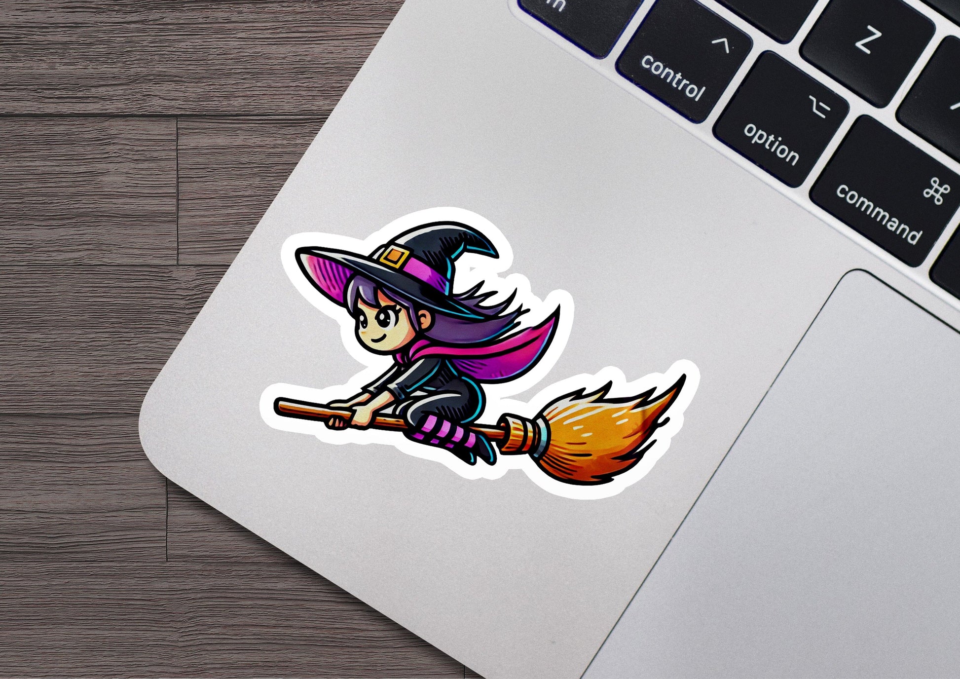 a sticker of a witch riding a broom