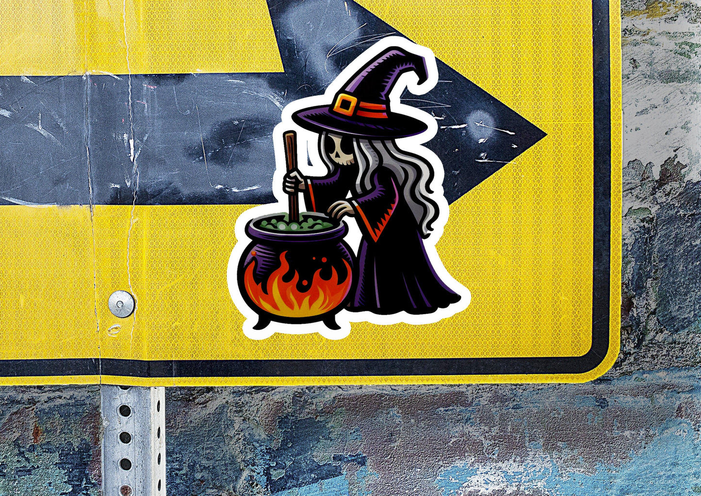 a sticker of a witch holding a caulder