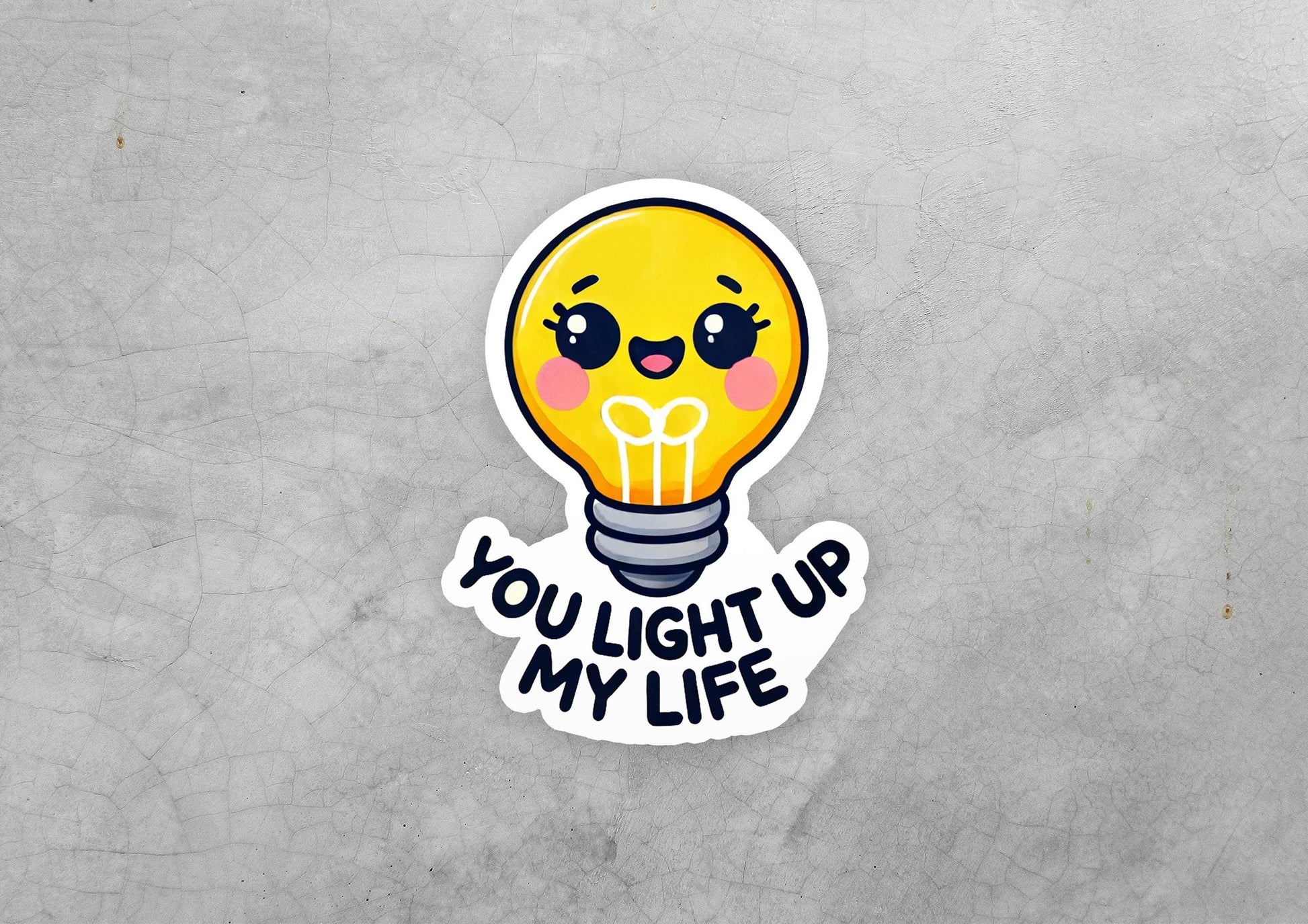 a sticker with a light bulb saying you light up my life