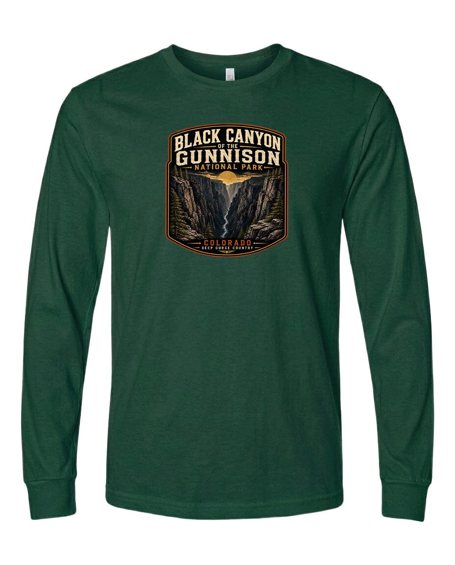 A green long-sleeved t-shirt with a graphic design depicting a mountainous landscape, specifically the Black Canyon of the Gunnison National Park in Colorado.